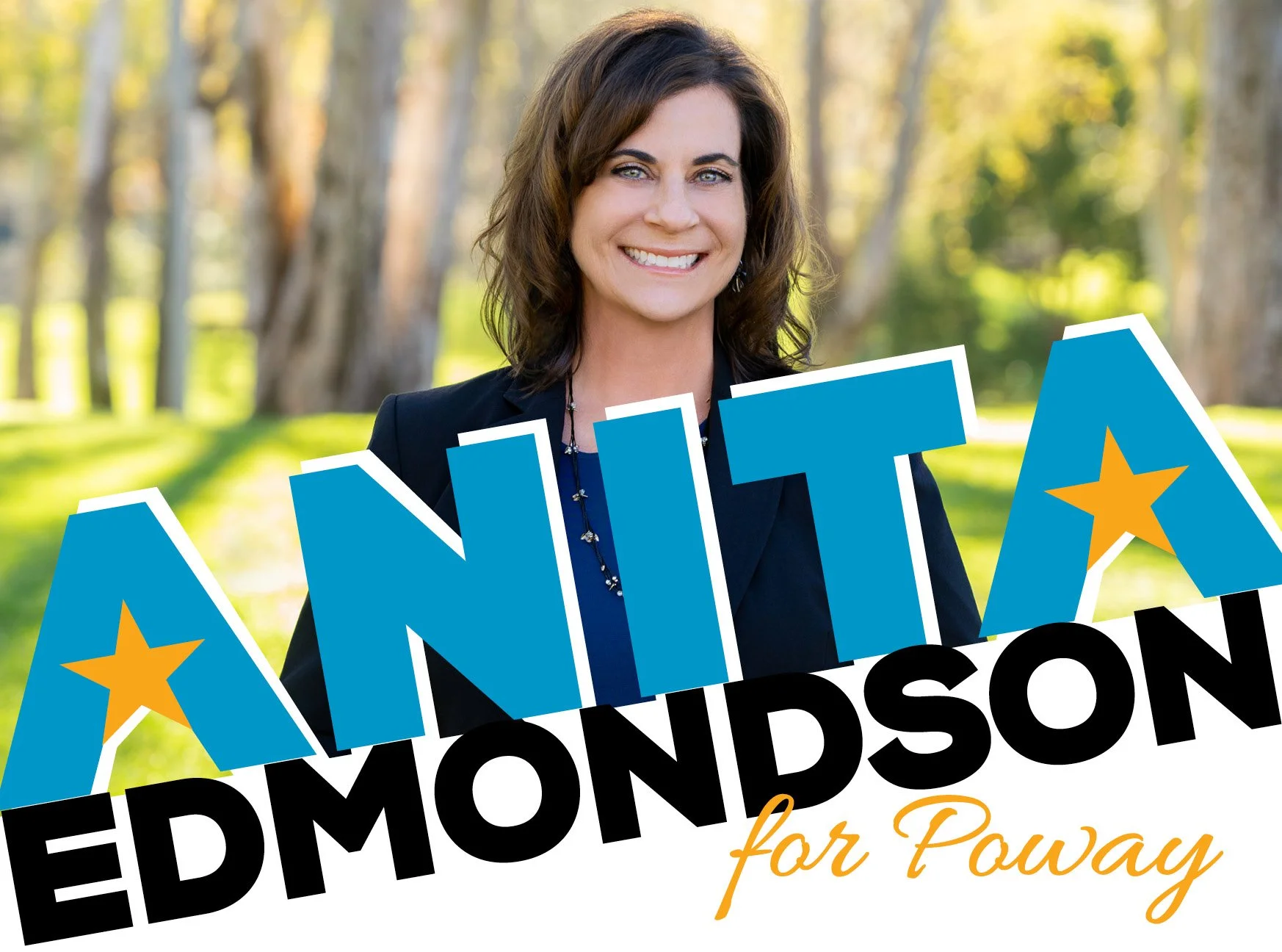 A woman with brown hair smiling outdoors in a park with trees in the background, holding a campaign sign that reads 'ANITA EDMONDSON for Poway' in large blue and black letters with stars and a cursive message.