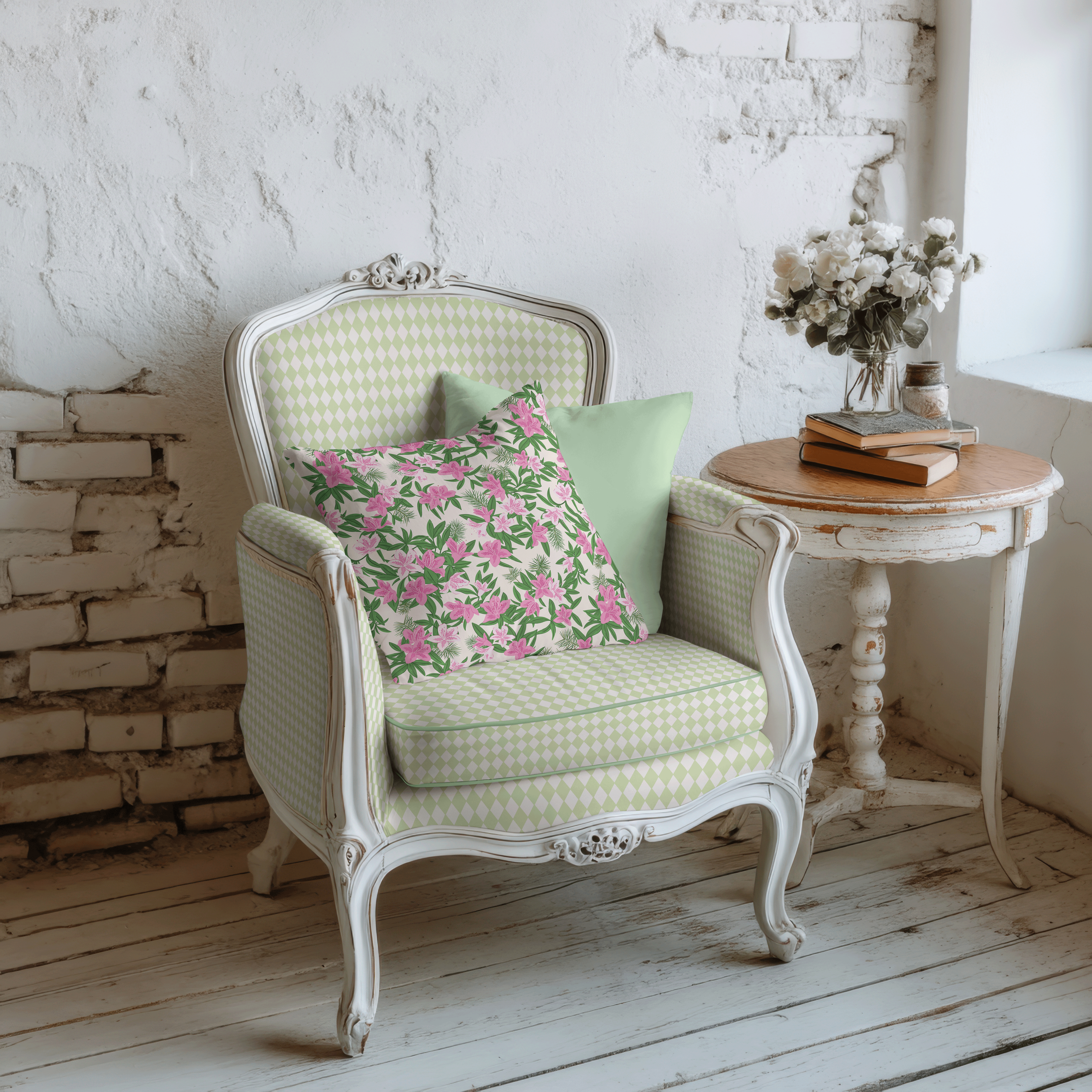 Clubhouse Diamonds geometric fabric upholstered on a vintage armchair with coordinating floral accent pillows.