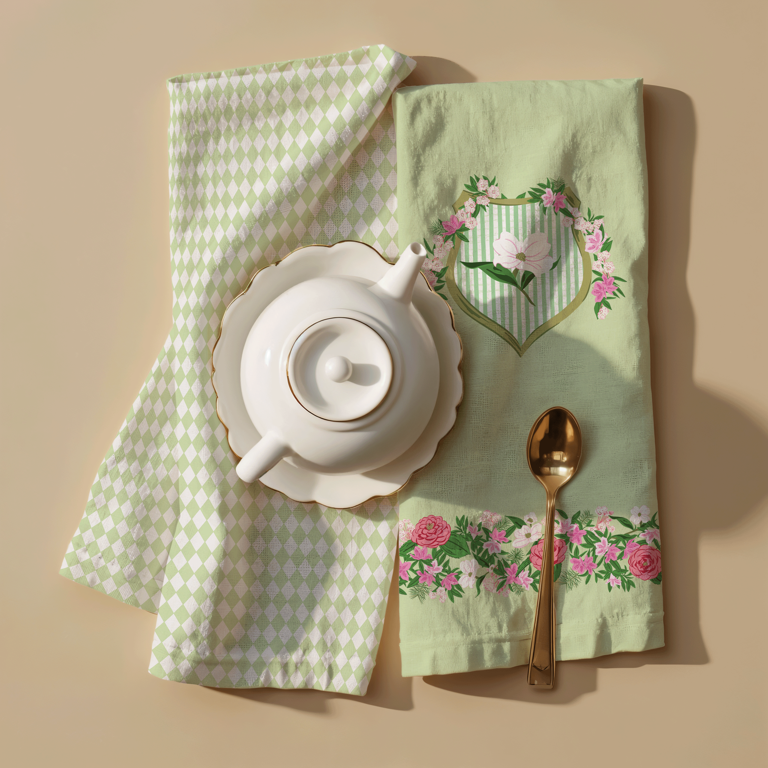 Decorative tea towel featuring the League Crest illustration paired with coordinating geometric fabric and tabletop accessories.