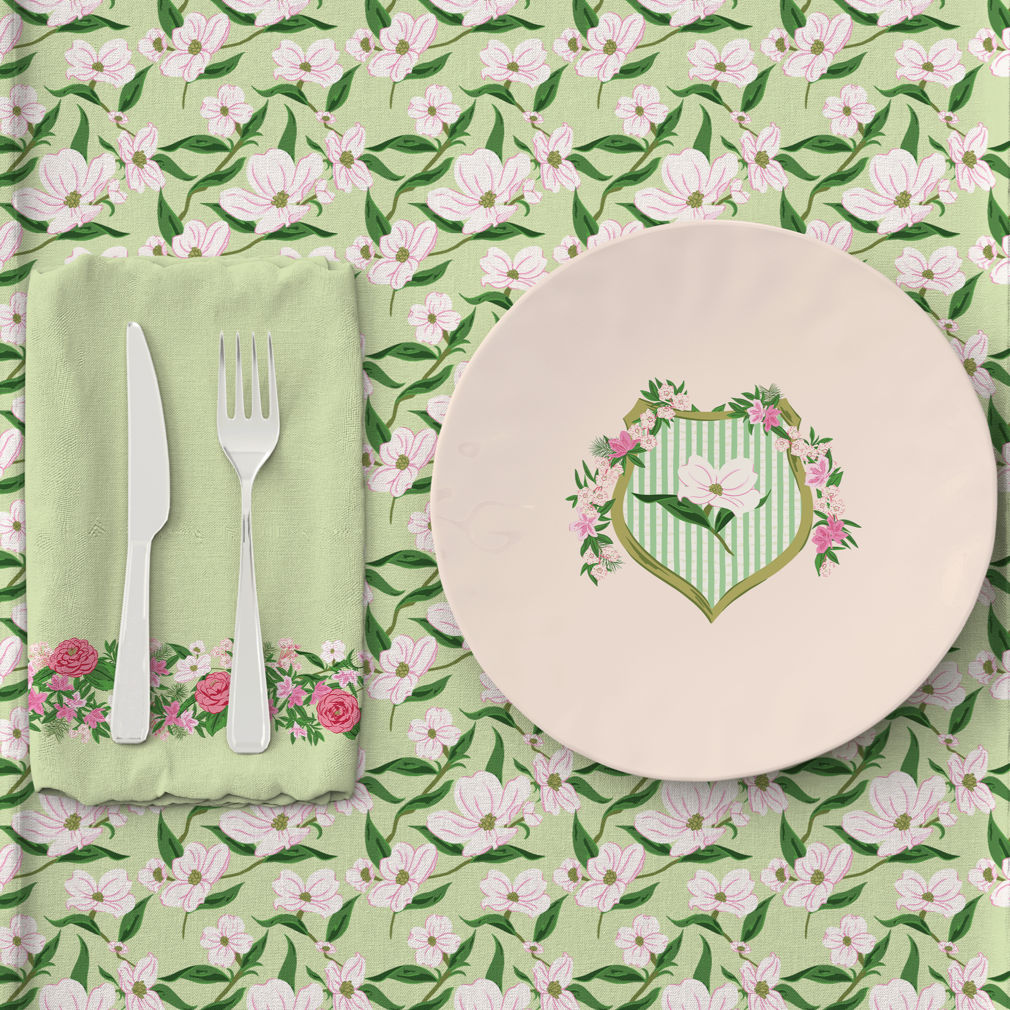 Coordinated tabletop design featuring the League Crest illustration on a dinner plate and napkin, styled with floral placemat fabric and decorative border trim.