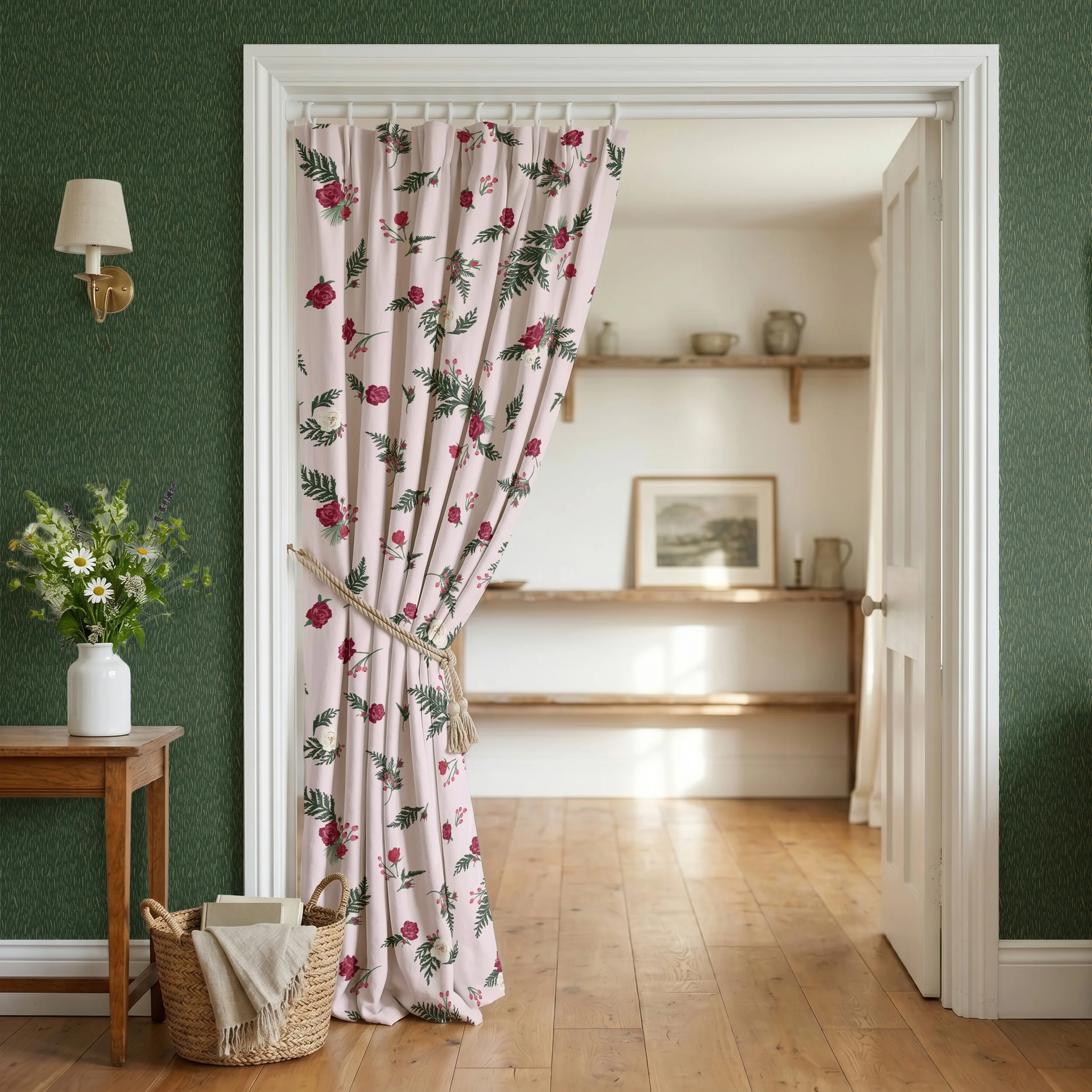 Floor-length curtains printed with scattered winter roses, evergreen sprigs, and berries, hanging against textured green walls with a subtle vertical pattern inspired by evergreen needles.