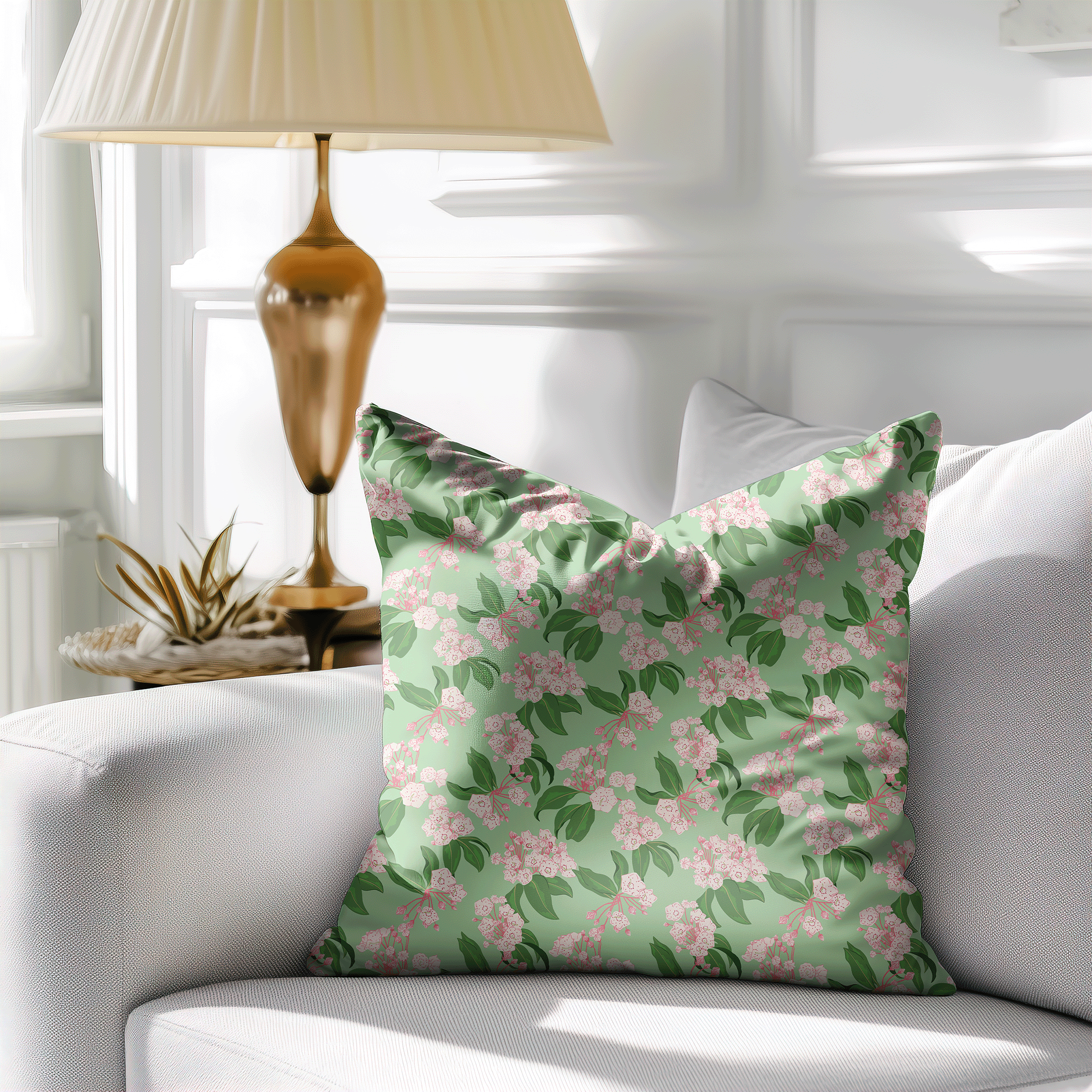 Mountain Laurel Charm floral fabric displayed on a decorative throw pillow in a classic living room setting.