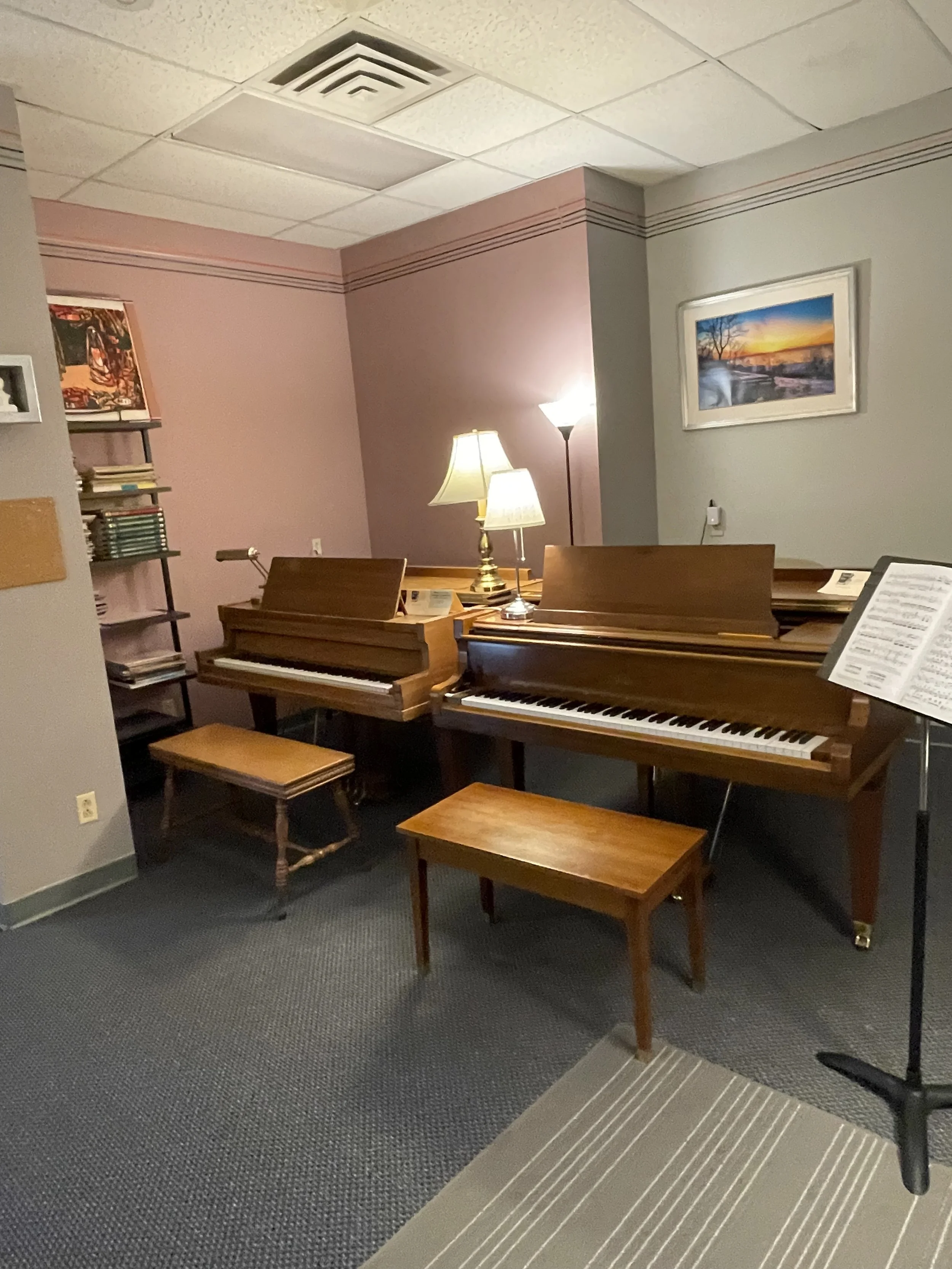 A cozy room with two pianos