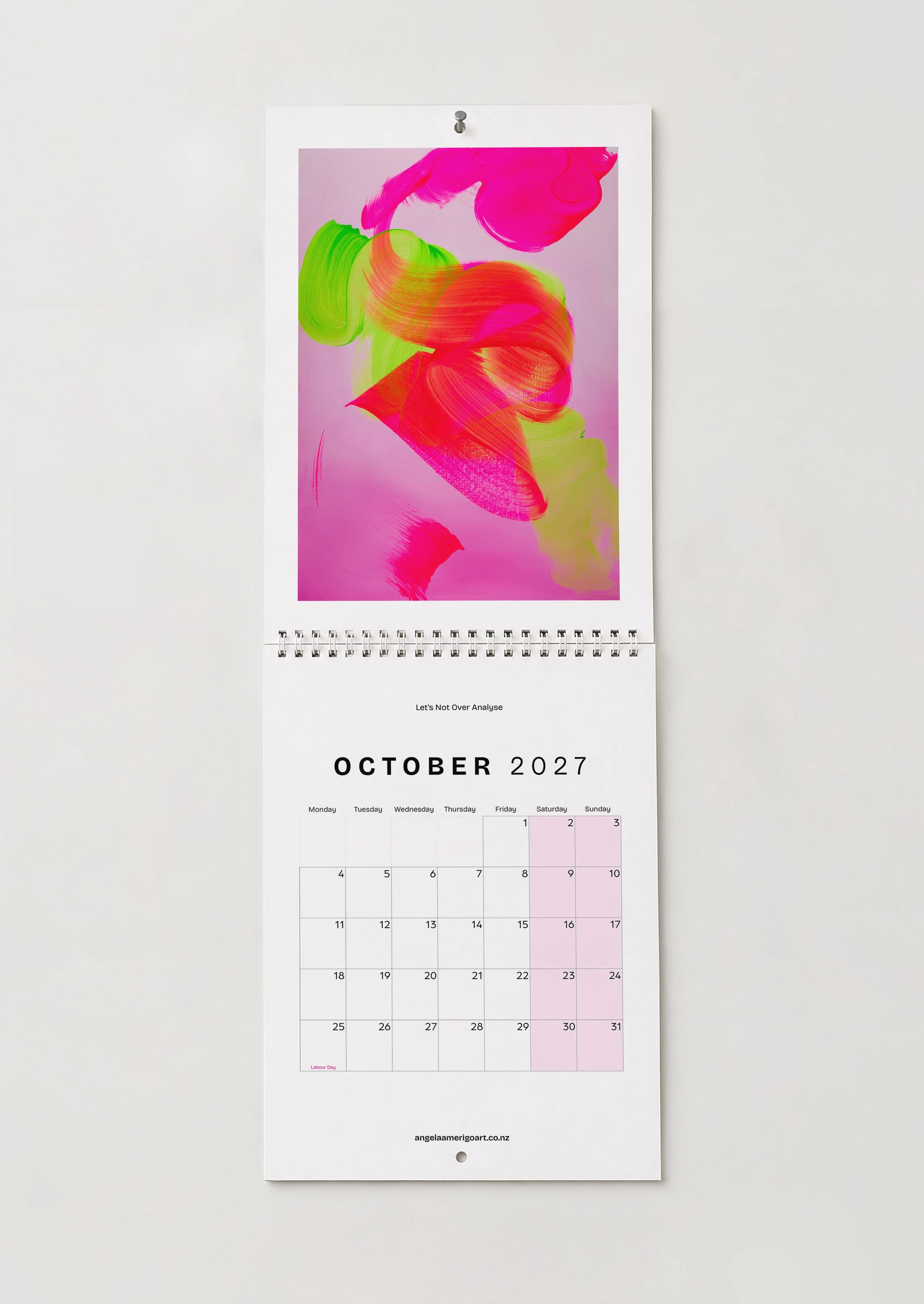 October — "Let's Not Over Analyse": October wall calendar page, pink and green brushstrokes on a soft lilac ground