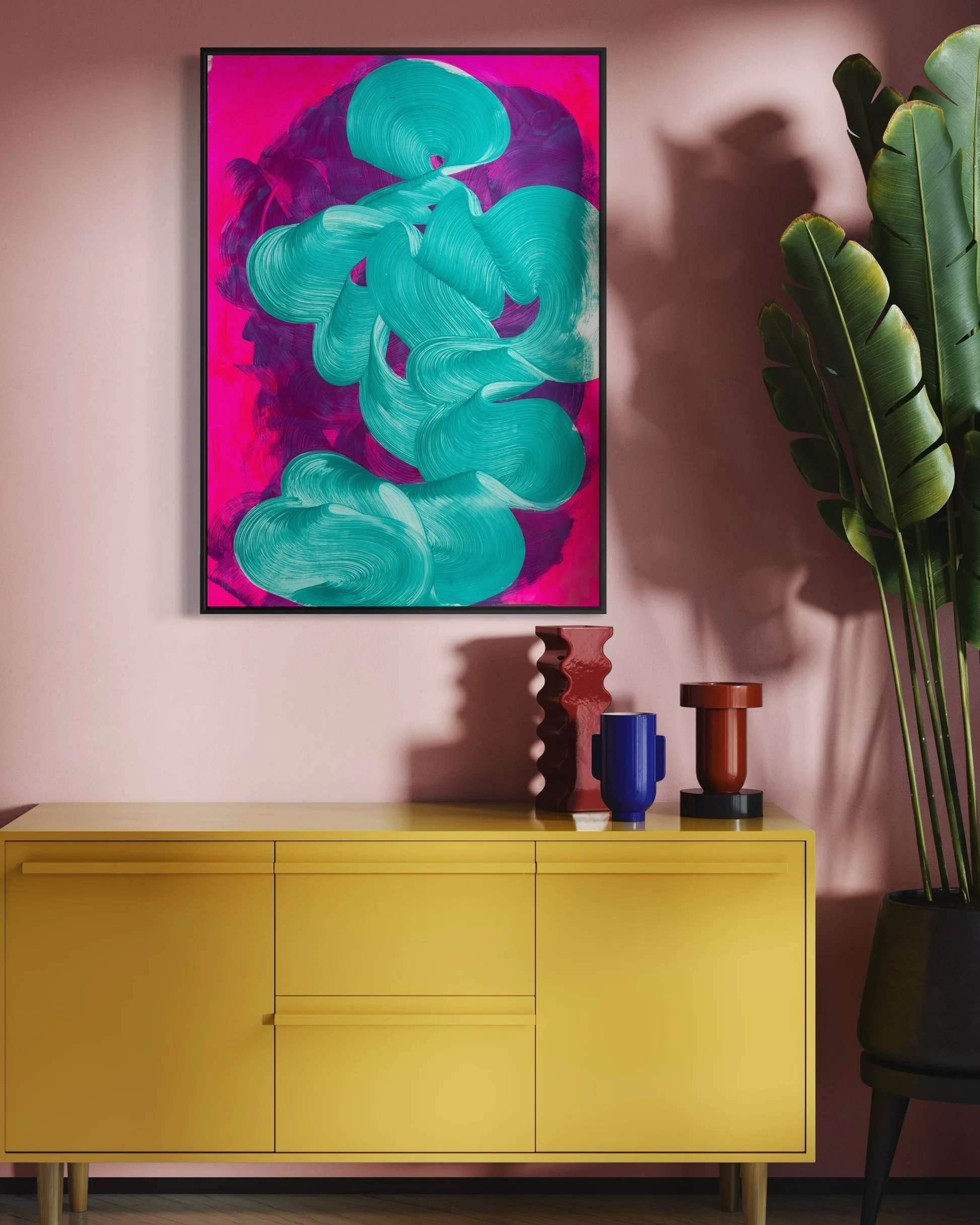 A colorful abstract painting with swirls of teal and purple on a pink background, hanging above a yellow sideboard with three drawers. On top of the sideboard are three decorative vases in red, blue, and brown. To the right is a tall potted plant with large green leaves.