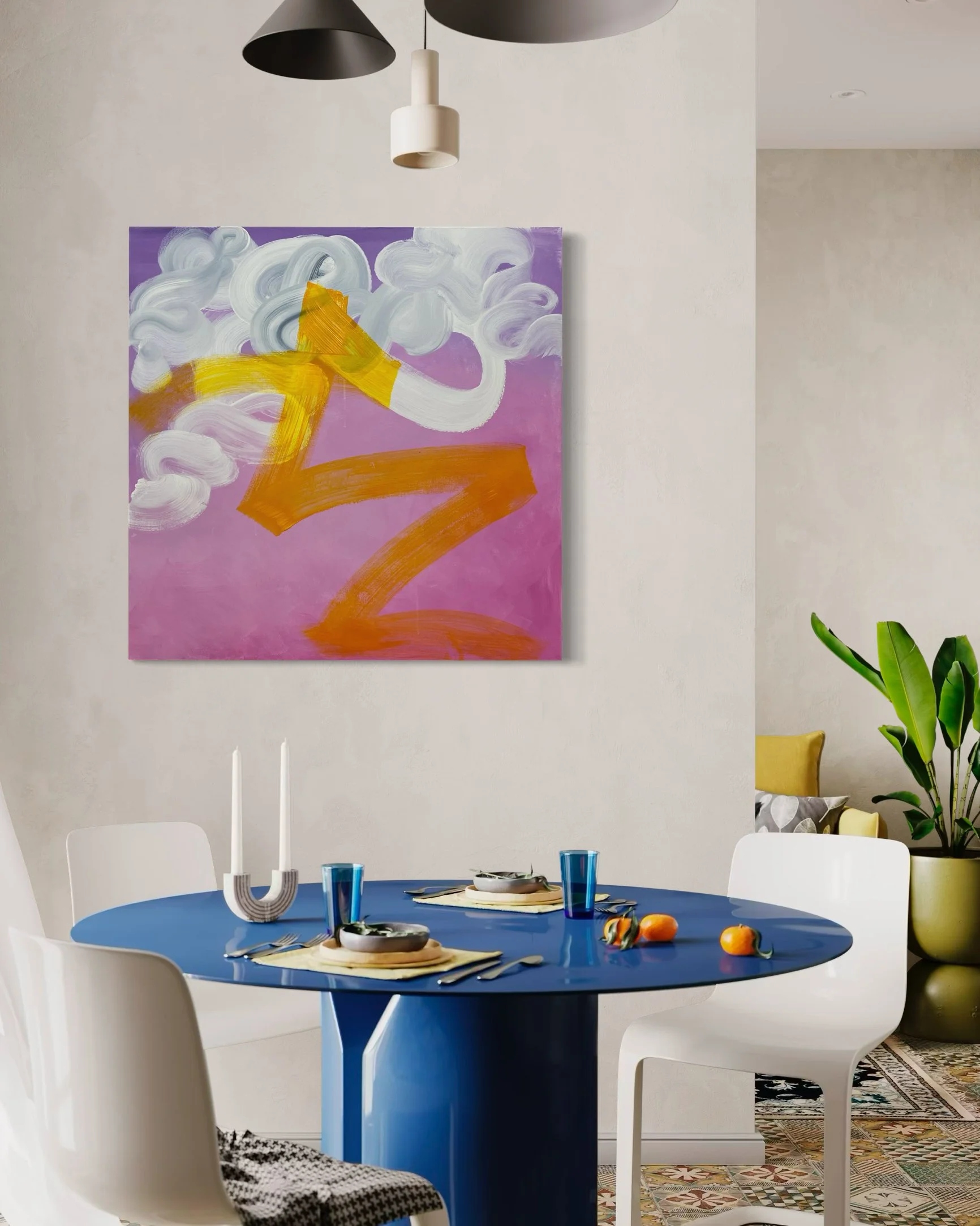 Modern dining room with a round blue table set with plates, glasses, and cutlery, white chairs, colorful abstract painting on the wall, and large potted plant in the corner.