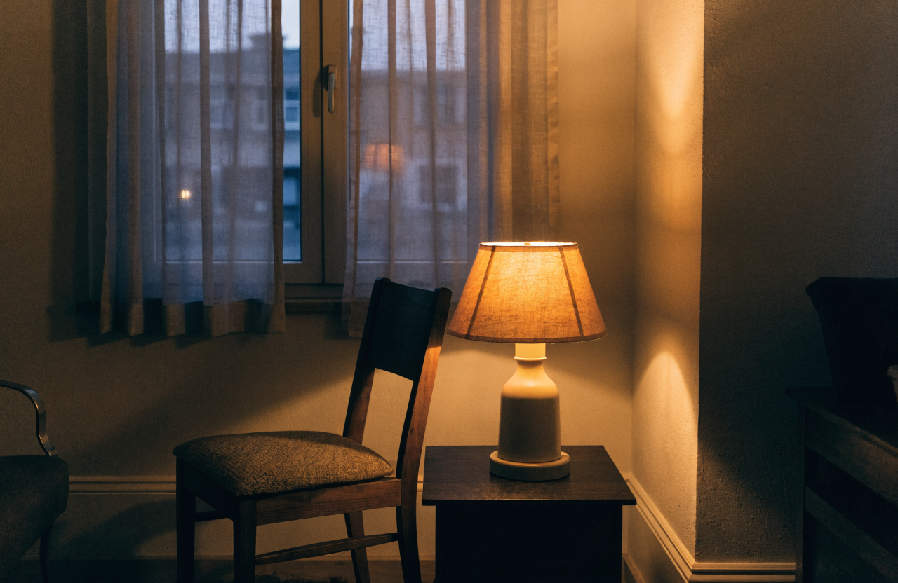quiet lamplit room representing waiting on God's security in Christ
