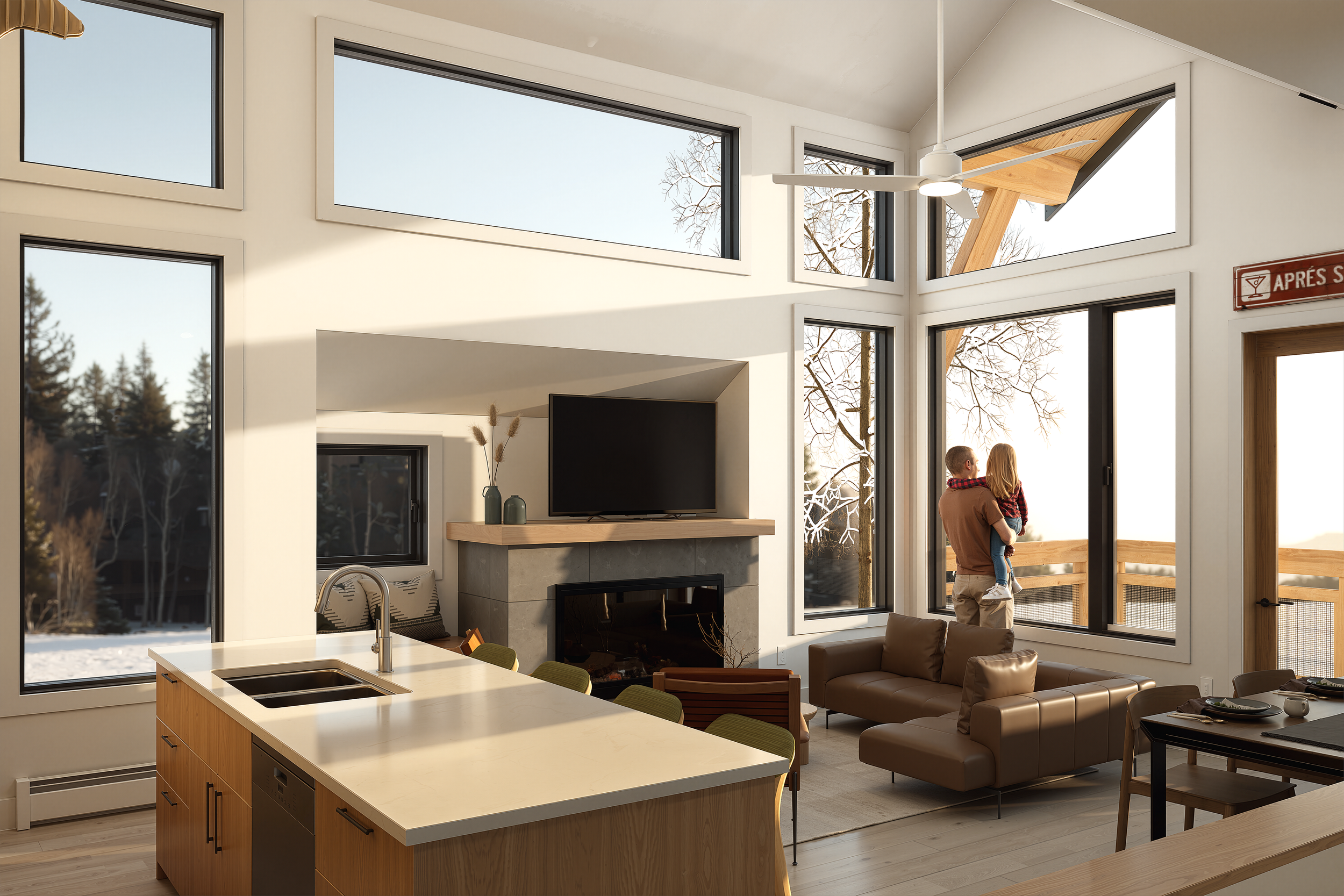Open-concept kitchen and living room at The Glades with vaulted ceilings, a stone fireplace, and a father holding a child at the window overlooking the balcony.