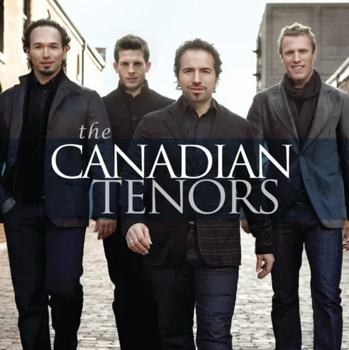 Four men in dark suits walking on a cobblestone street with buildings in the background, with the words "the Canadian Tenors" overlaid.