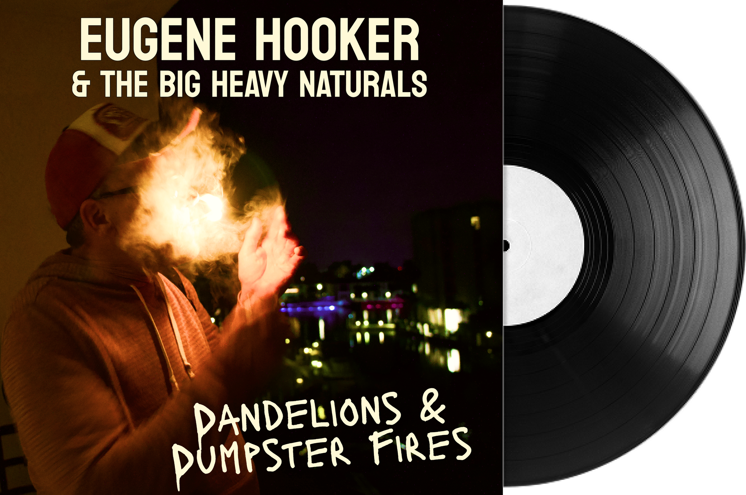 Album cover featuring Eugene Hooker & The Big Heavy Naturals with a person in a hoodie and cap, smoking with smoke illuminated by a bright light, against a nighttime cityscape with lights reflected on water, and text that reads "Dandelions & Dumpster Fires".