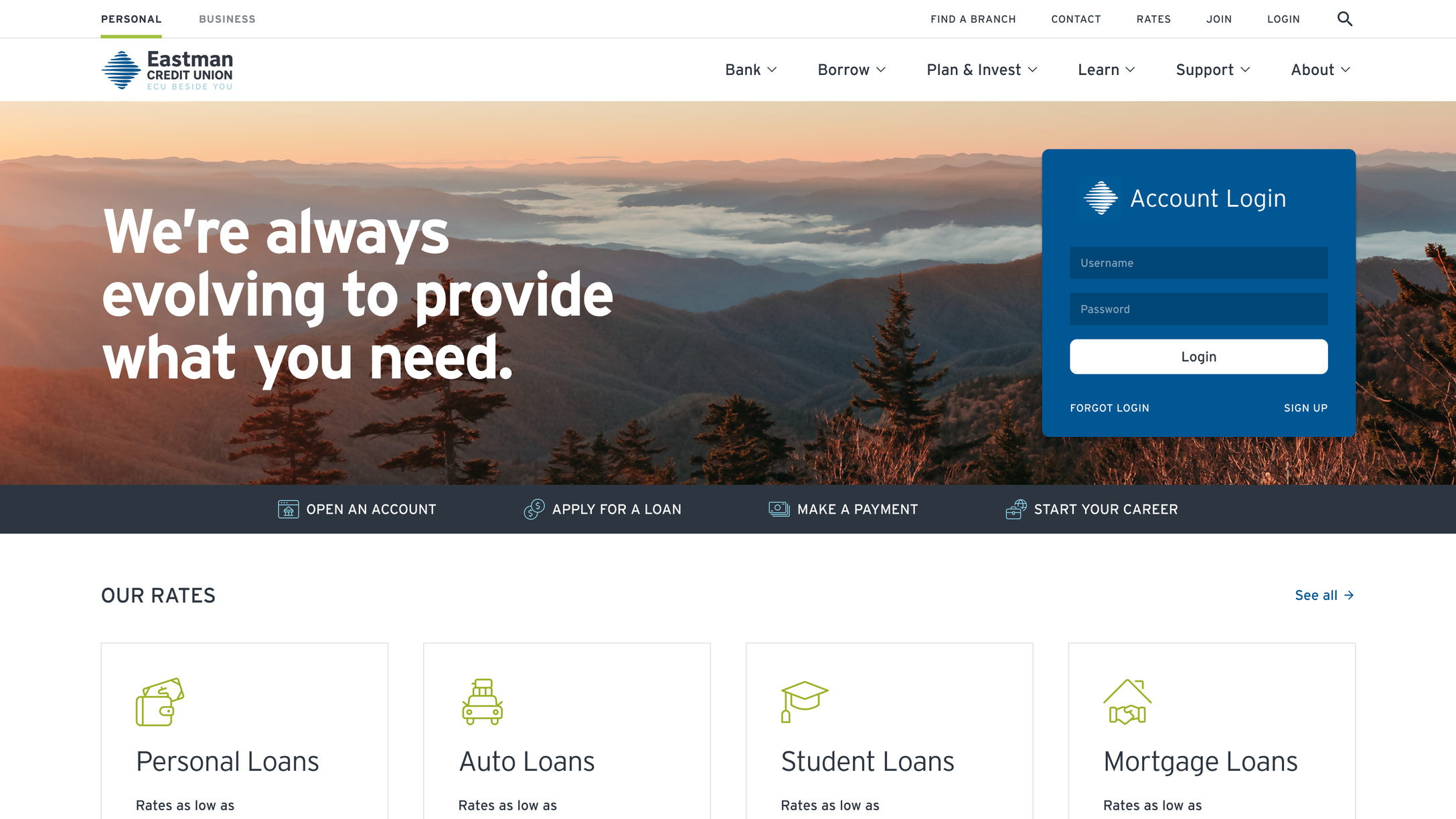 Eastman Credit Union homepage with a background image of mountains and trees, featuring a blue account login box. The website offers options to open an account, apply for a loan, make a payment, and start a career, along with information about loan rates including personal, auto, student, and mortgage loans.