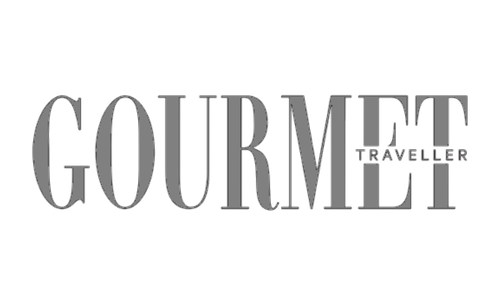 Gourmet Traveller logo in gray and white text.