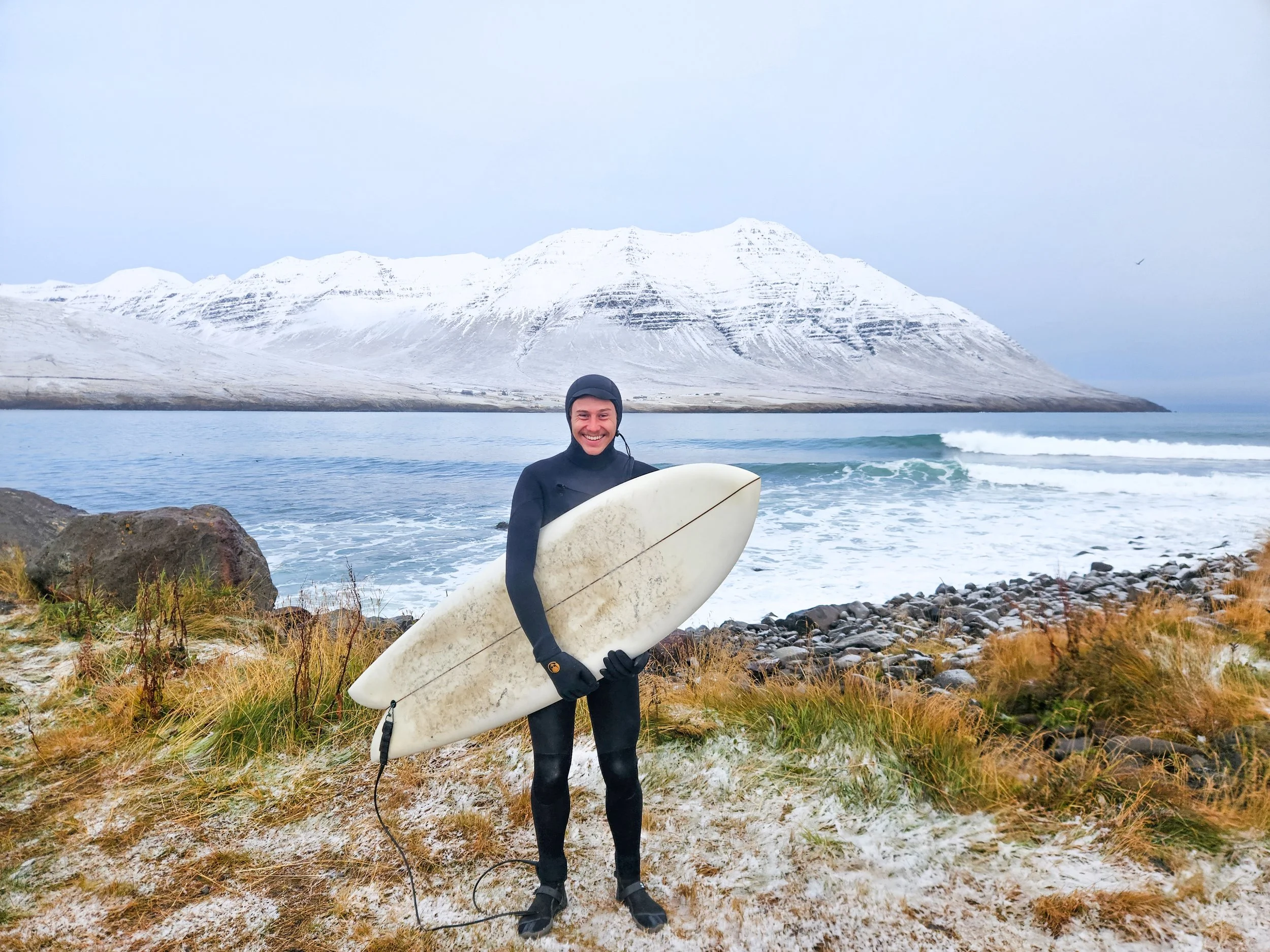 The most memorable surf of my life. I woke up to a fresh layer of snow over the fjord, and had this dreamy Arctic point break to myself for the morning. Photo - Marc Zotes.