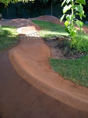 backyard pump track with landscaping 6.jpg