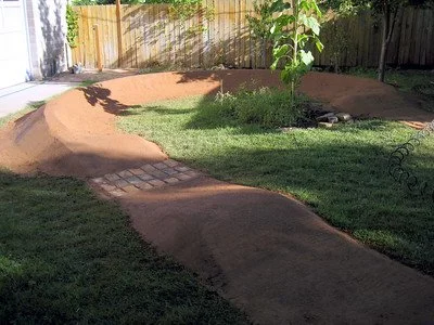 backyard pump track with landscaping 5.jpg