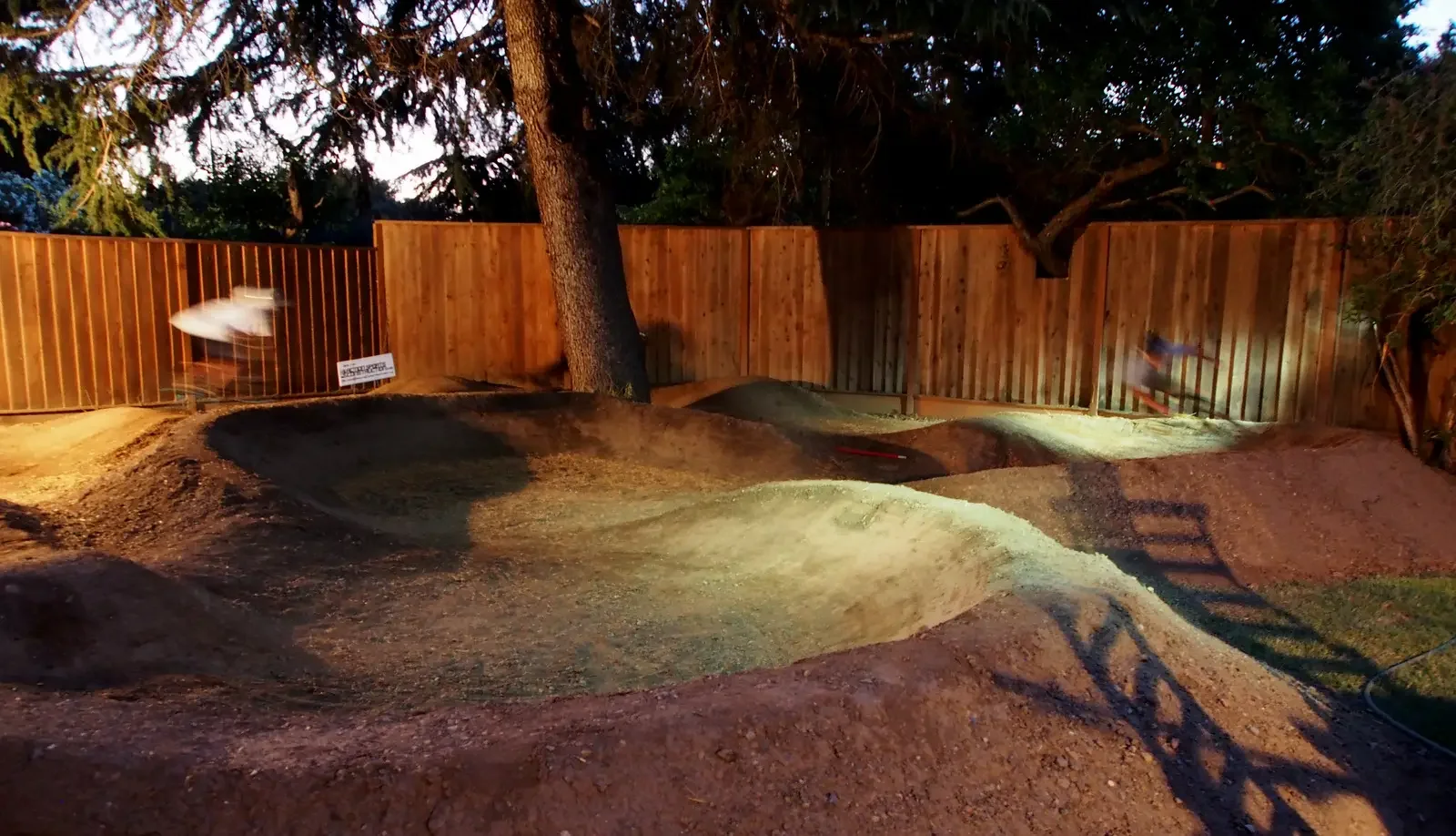 nightime backyard pumptrack.webp