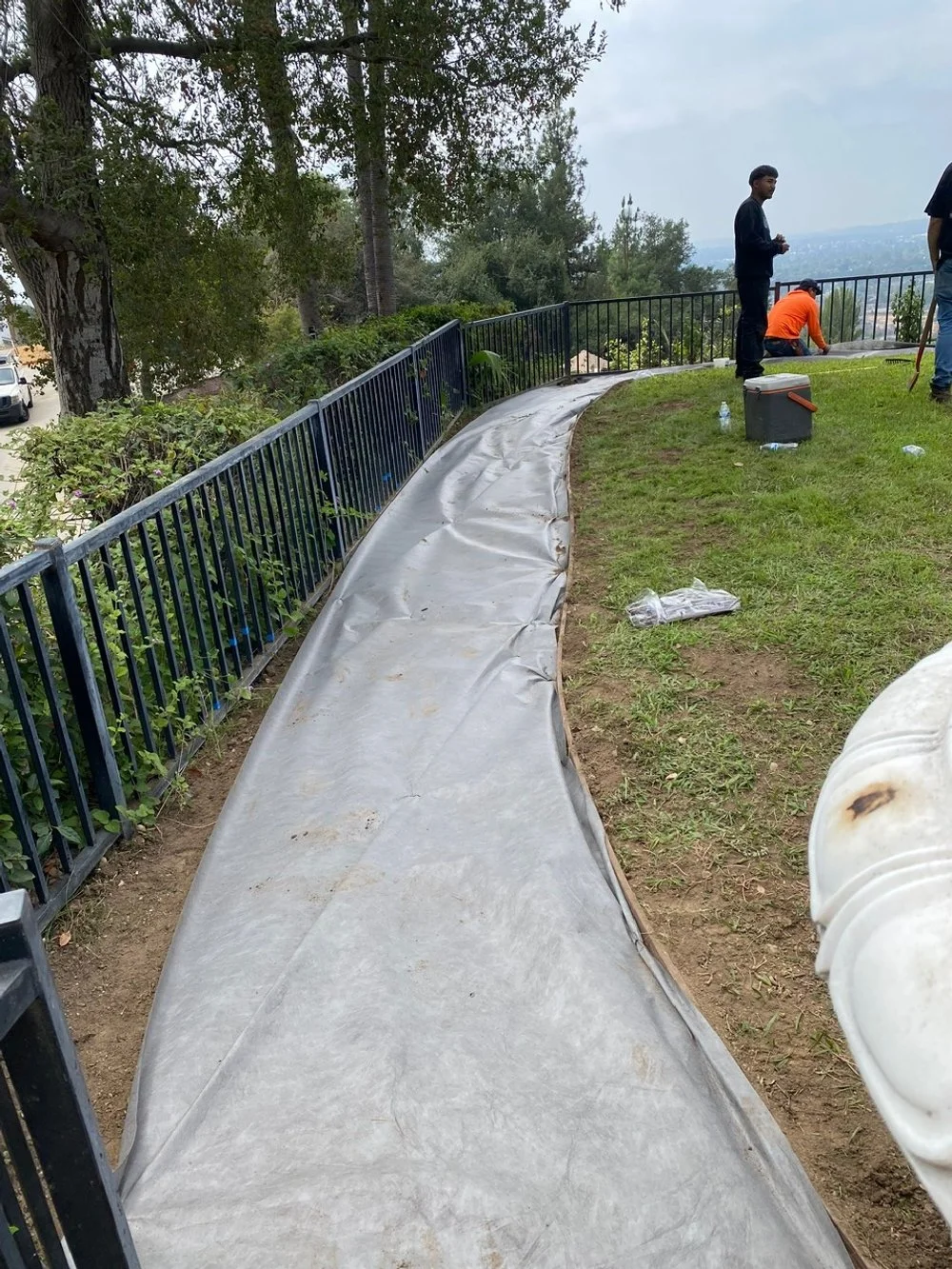 laying down weed barrier