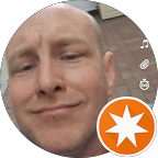 Close-up of a man's face with a slight smile