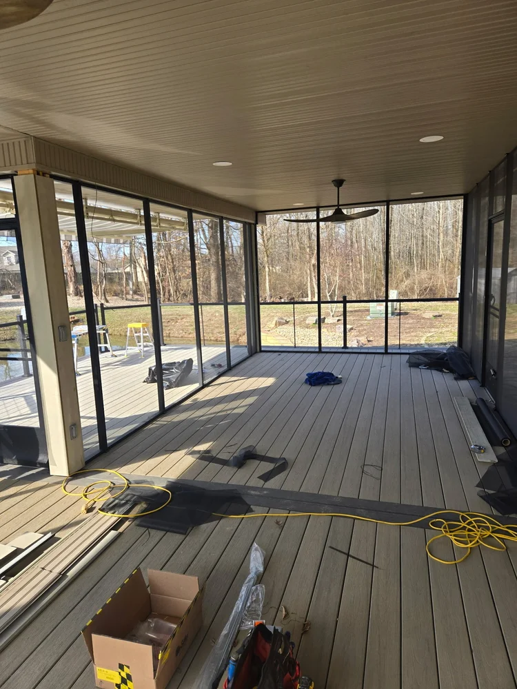 Enclosed porch interior with ceiling fan built by Tenbarge Exteriors