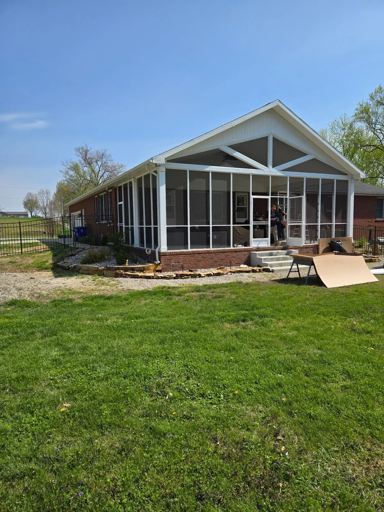 Screened-in porch with gable roof built by Tenbarge Exteriors in the Evansville area