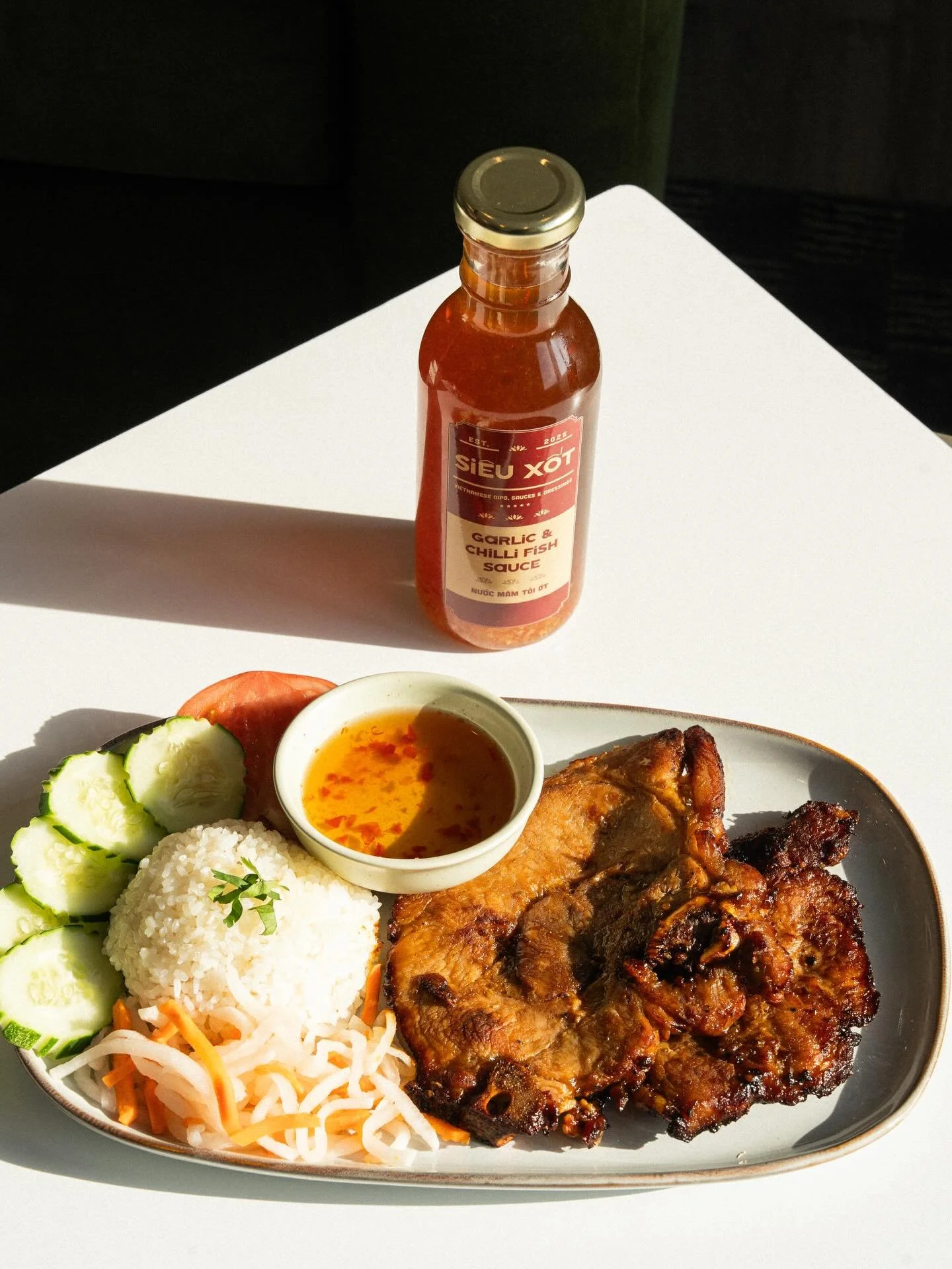 Our fish sauce is a true Vietnamese pantry staple 🇻🇳✨ &mdash; the perfect finishing touch for all your favorite dishes.

Dishes liek Cơm Cuốn Nướng &amp; Bun Thit Nuong aren&rsquo;t complete without a drizzle of our Garlic Chili Fish Sauce 🌶️🧄 &m