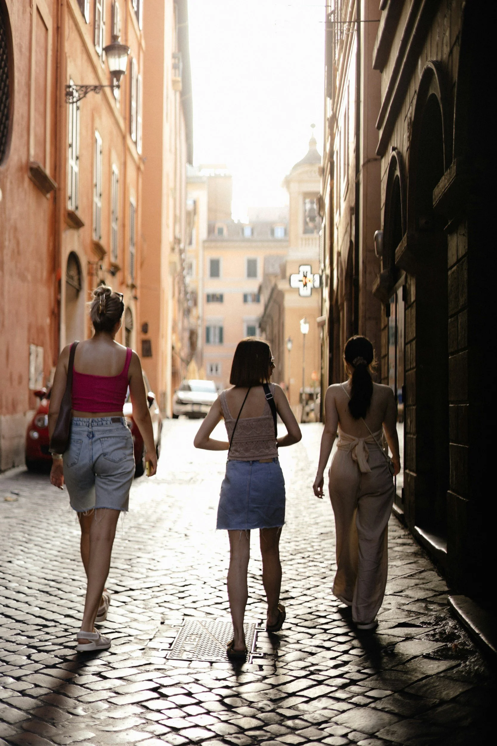 women walking down street in Rome