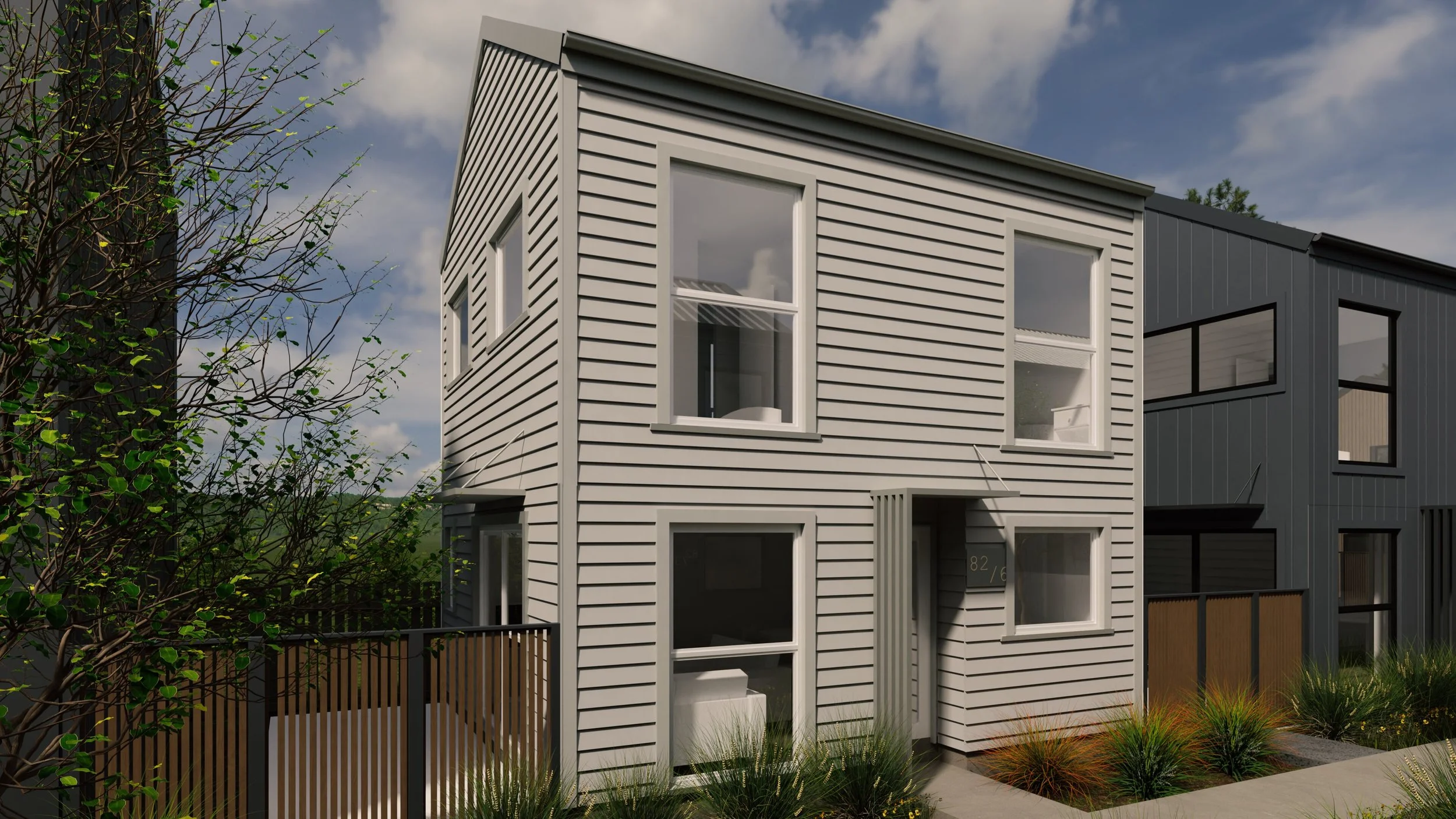Light-cladding townhouse in 8 lot subdivision with recessed entry and modern detailing