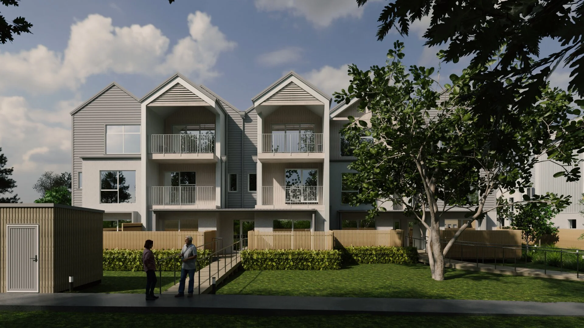 Front elevation of multi-unit townhouse development with gable roofs and upper-level balconies
