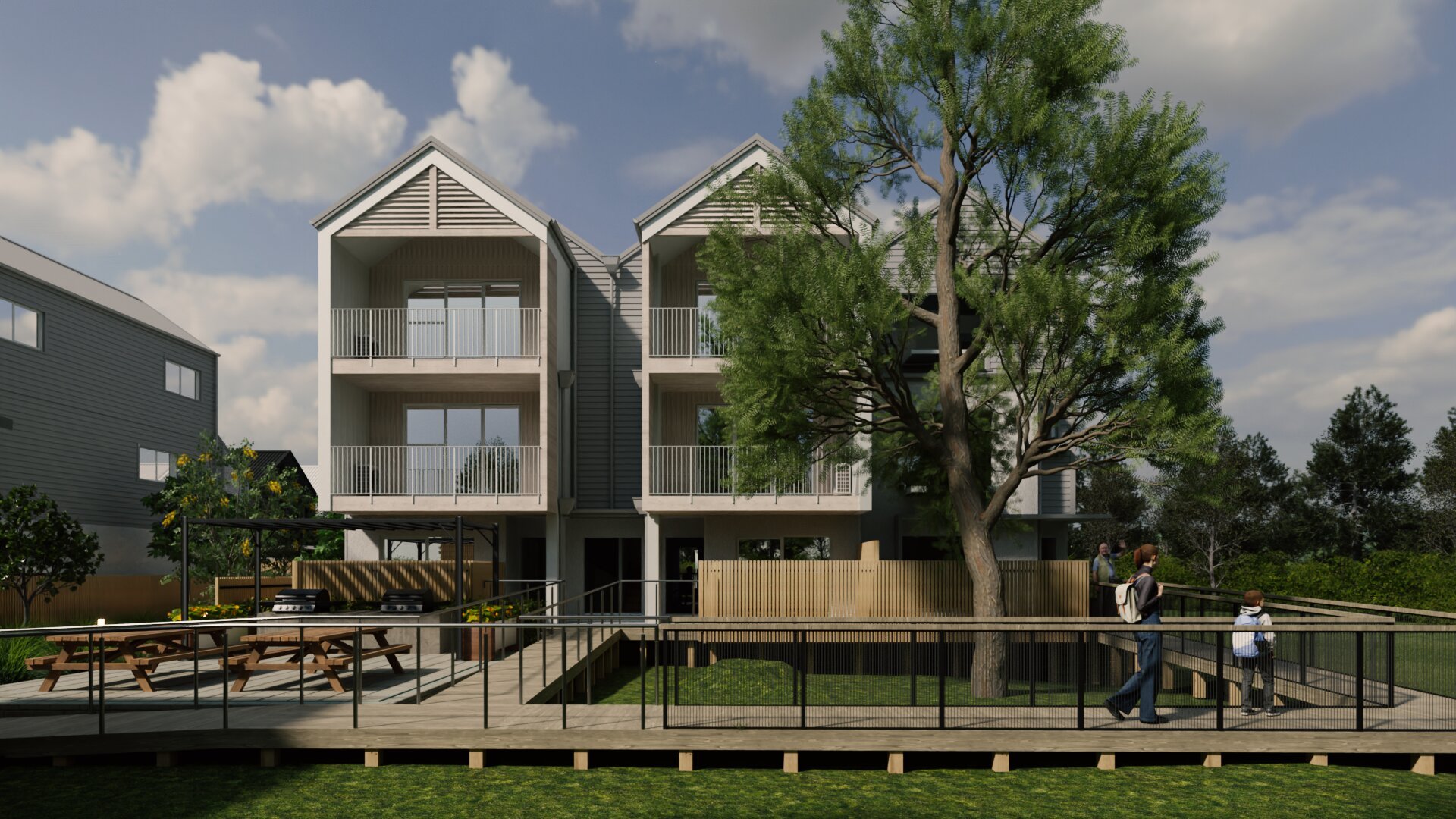 Front elevation of multi-unit townhouse development with gable roofs and upper-level balconies