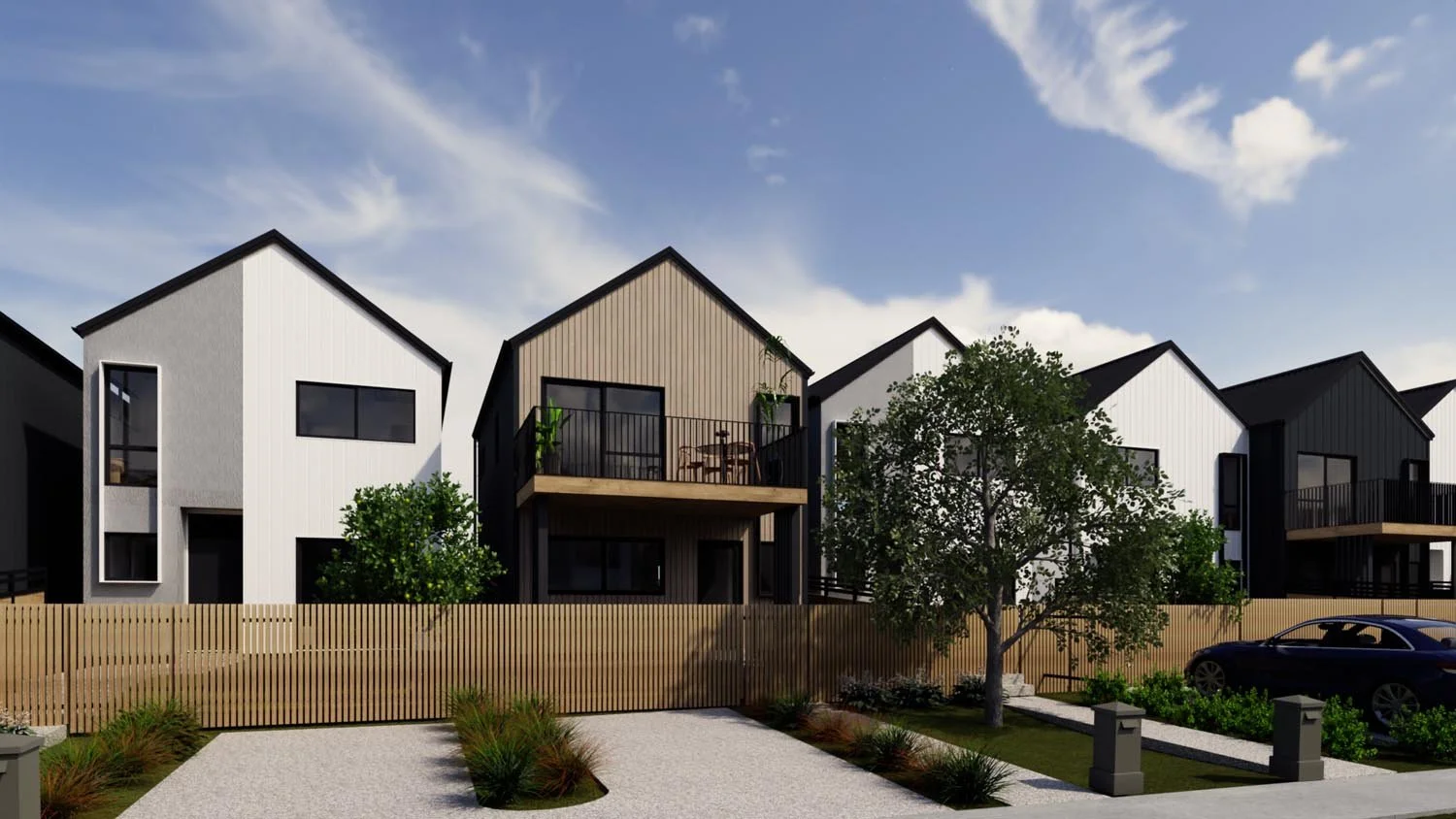 Row of modern townhouses with consistent gable forms and varied materials