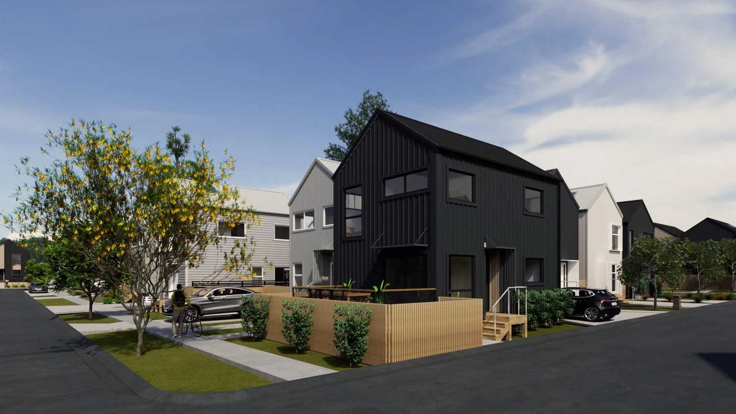 Corner view of modern housing development with landscaping and pedestrian paths