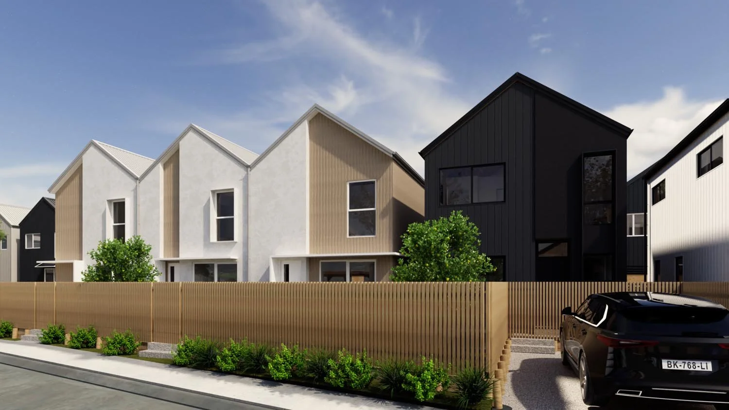 Modern townhouse development featuring mixed material facade and urban streetscape
