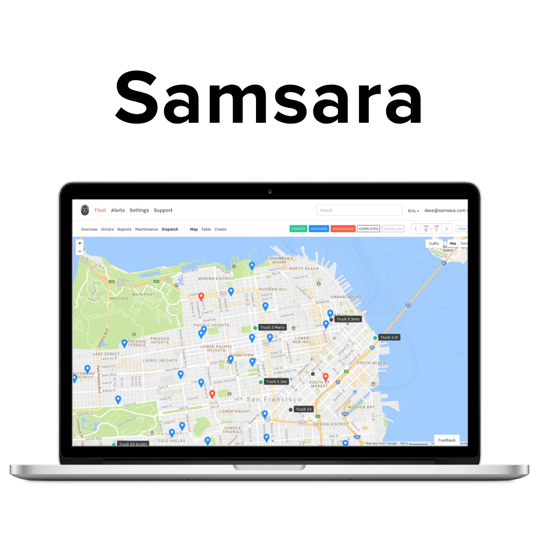 Laptop displaying a map of San Francisco with various markers and truck icons, indicating fleet tracking or vehicle locations.