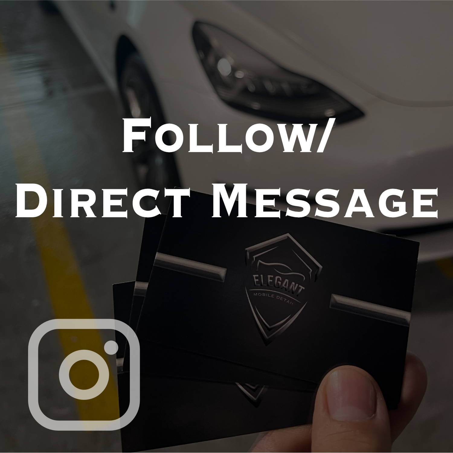 Person holding a business card with a shield logo and the words "Elegant Mobile Detail," in front of a white sports car parked in a garage.