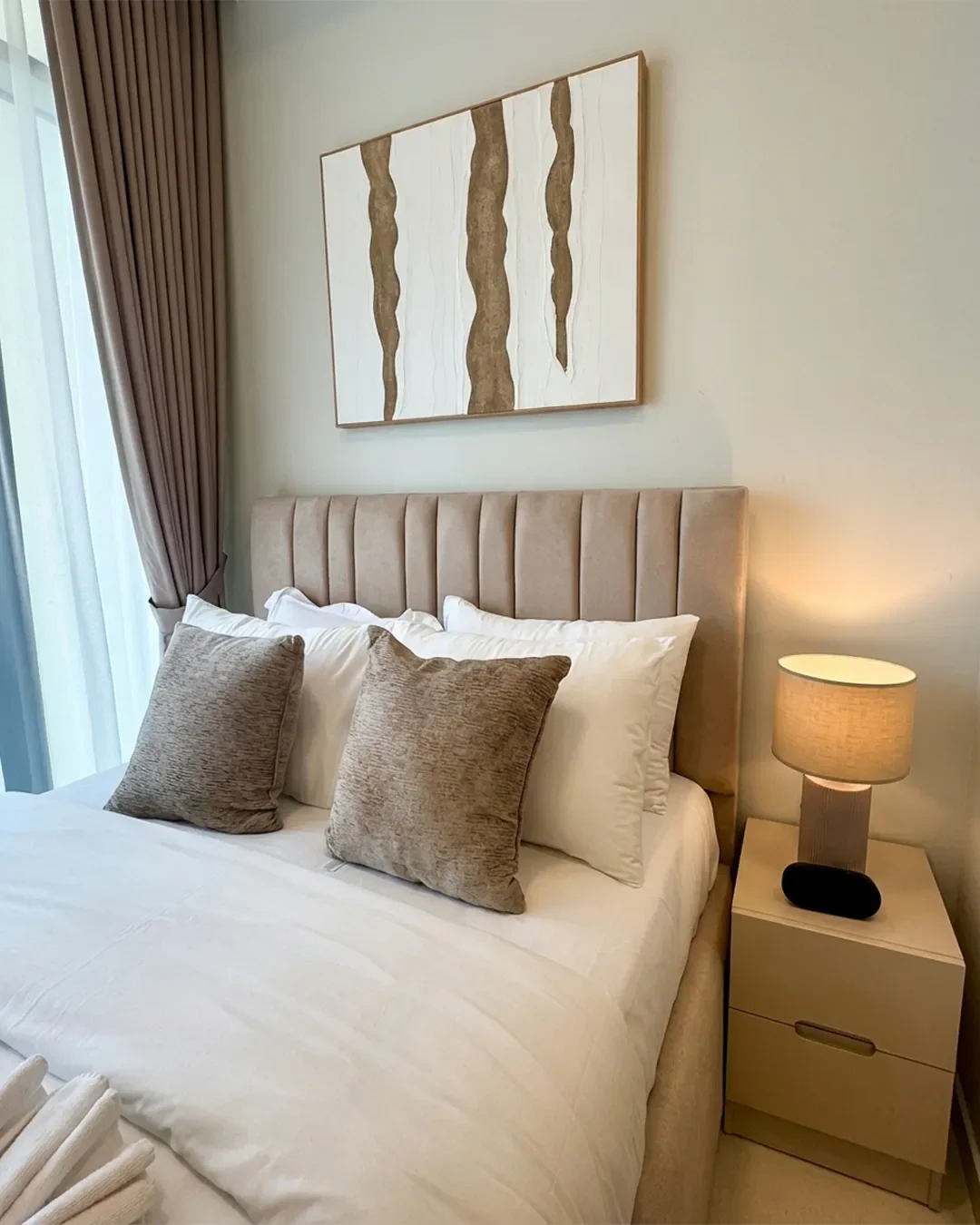 Modern guest bedroom in 22nd floor Business Bay apartment designed for comfortable residential living in Dubai.