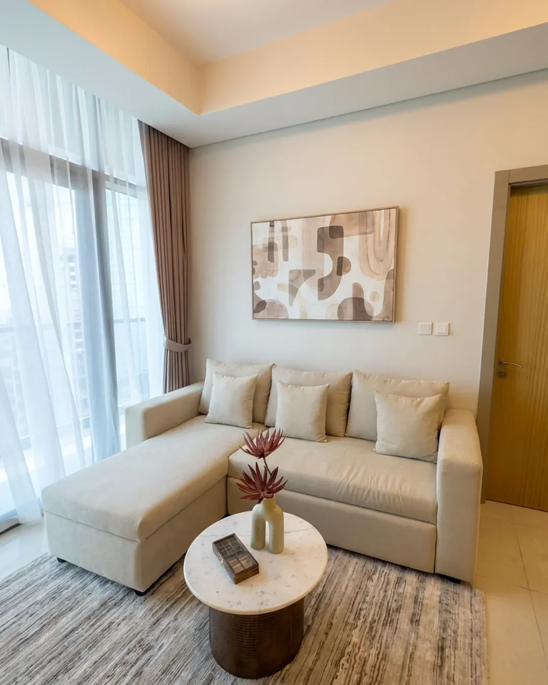 Spacious living area in fully furnished Business Bay apartment designed for long-term residential comfort.