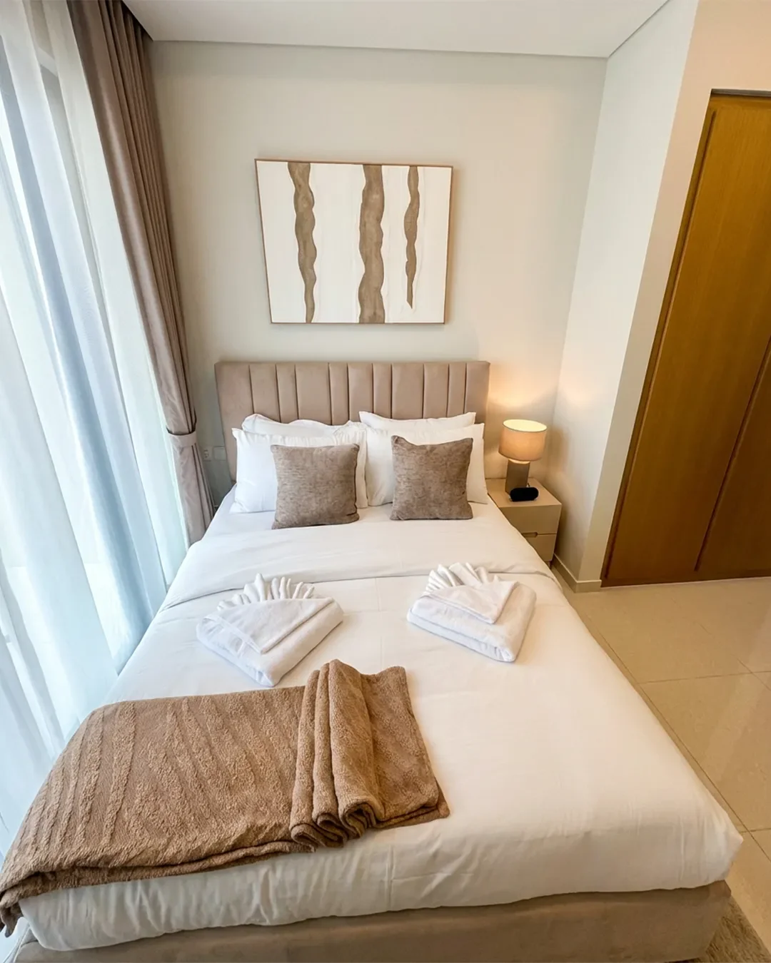 Bright secondary bedroom in fully furnished 2-bedroom apartment in Business Bay, ideal for guests or family living.