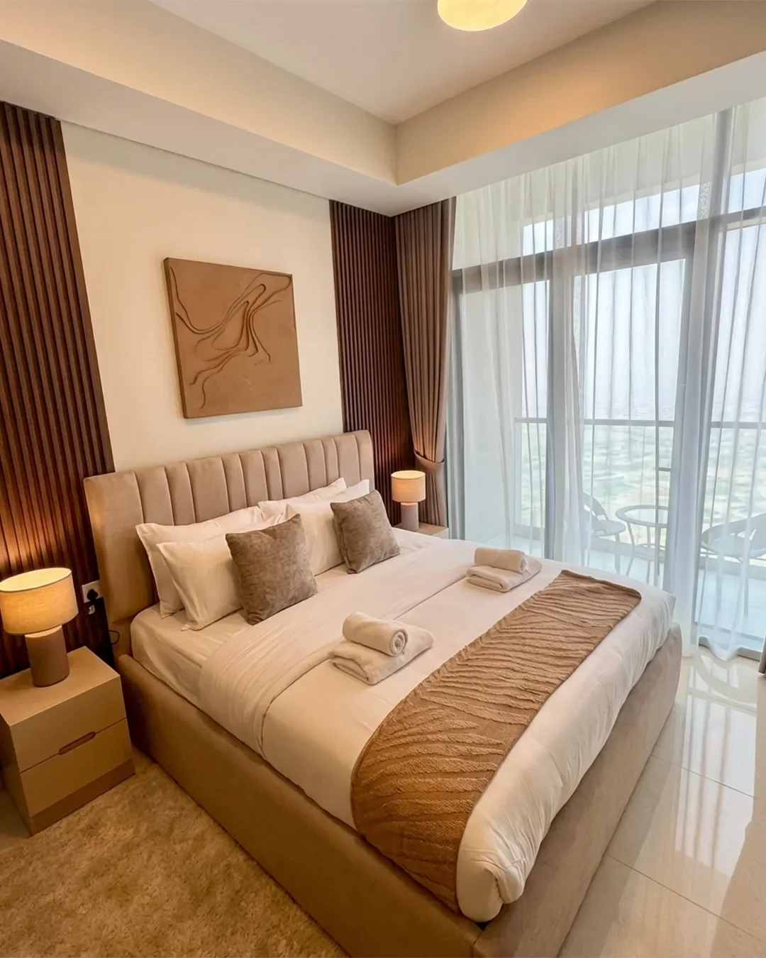 Spacious master bedroom in fully furnished 2-bedroom apartment in Business Bay, located on the 22nd floor with modern finishes and natural light.