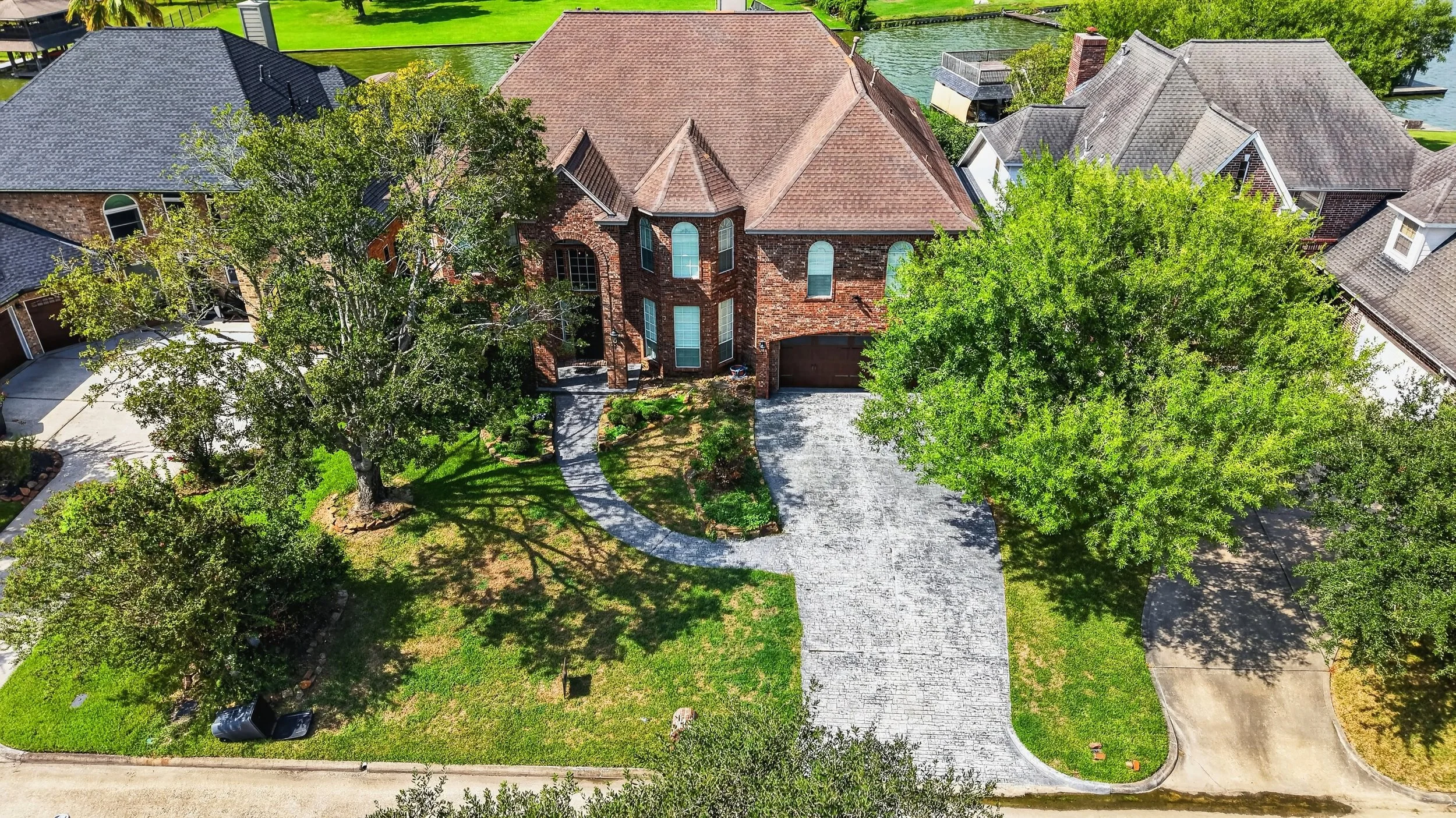 Landscaped garden and stone path beside the front entry
