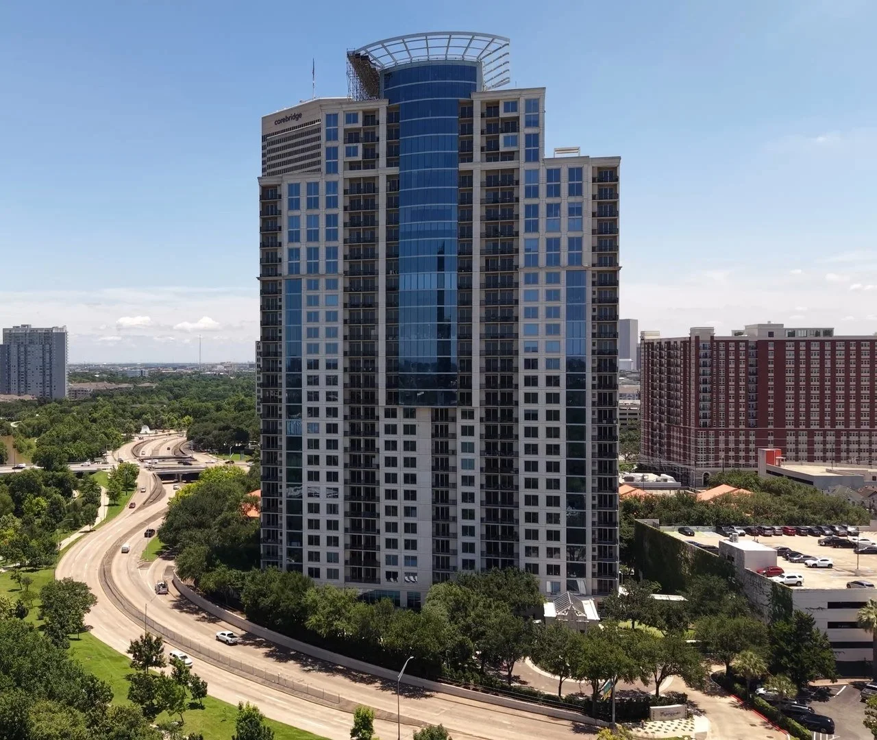 Aerial drone photo of a Houston high rise tower along Allen Parkway and Buffalo Bayou