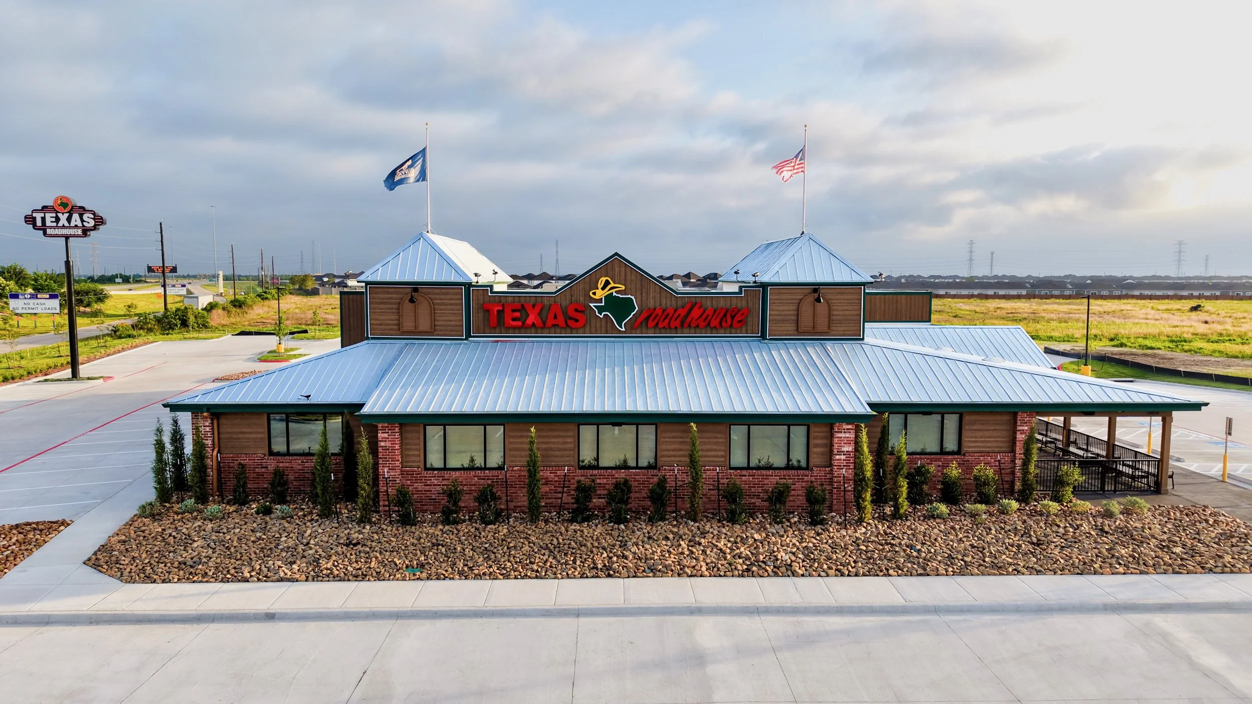 Aerial photo of a completed commercial restaurant property in the Houston area at sunrise, captured for marketing and documentation
