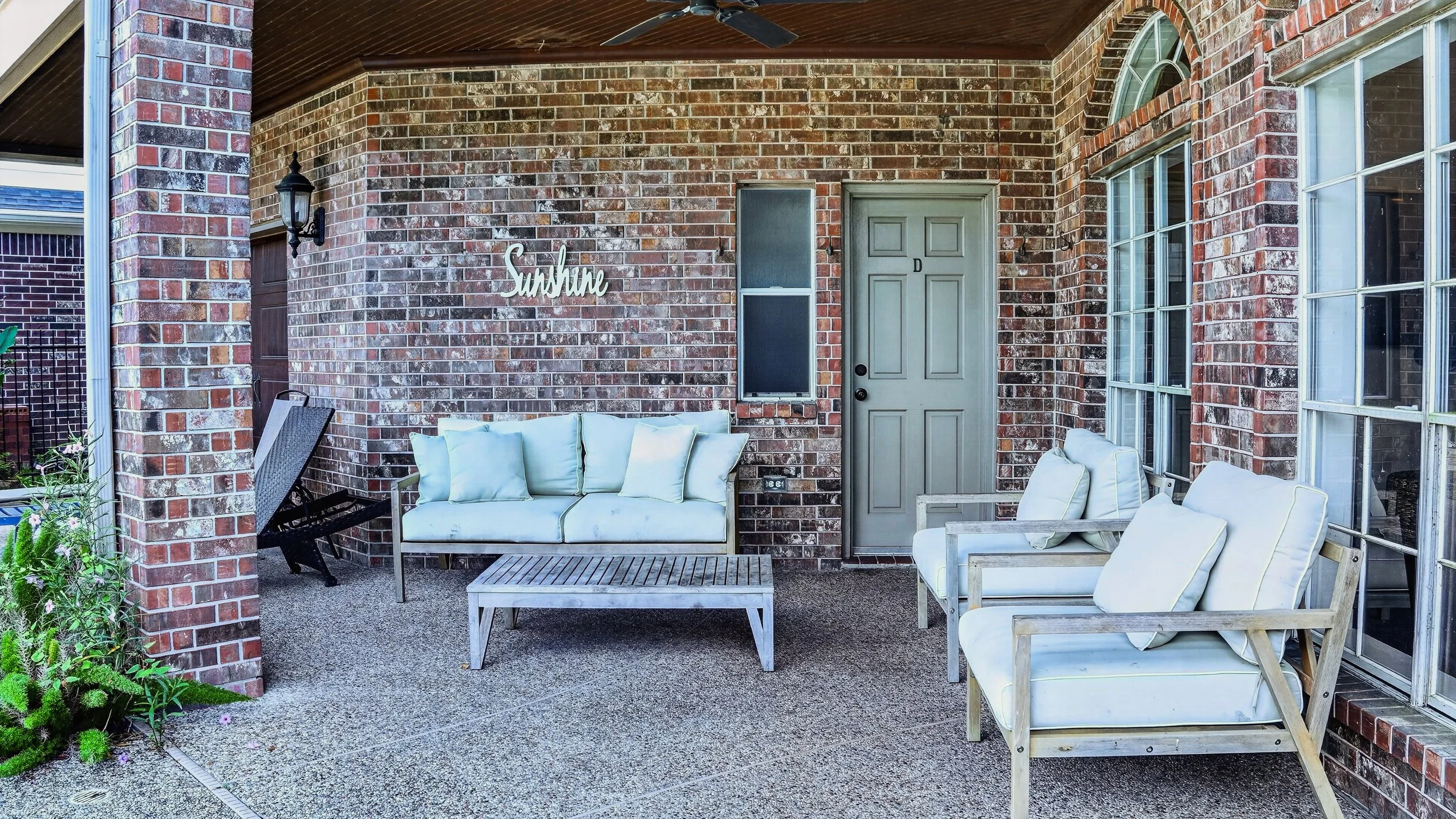 Sitting room with blue chairs and a patterned accent wall