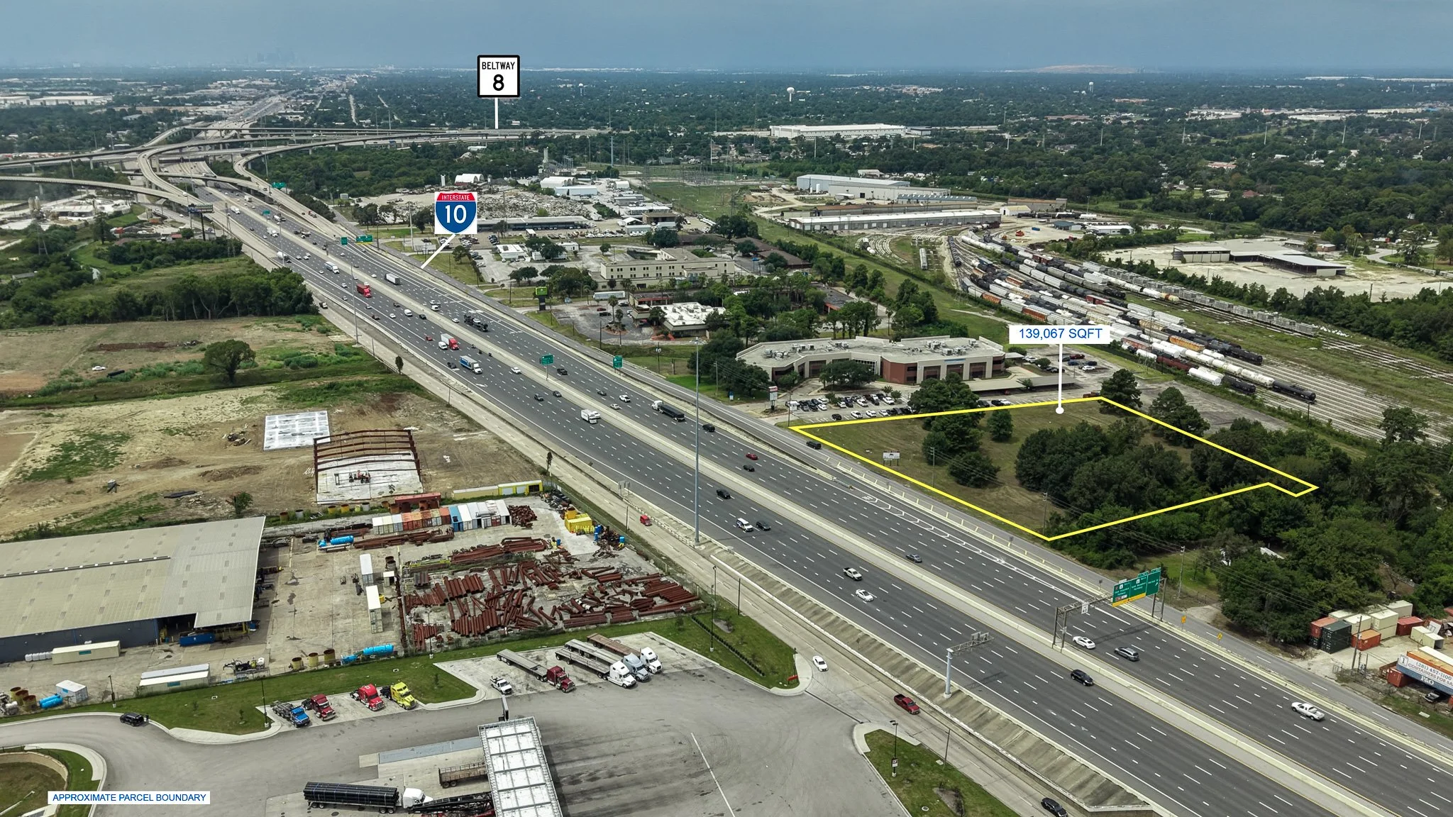 Wide aerial view of the lot along Interstate 10 in Channelview, TX, with the boundary outlined