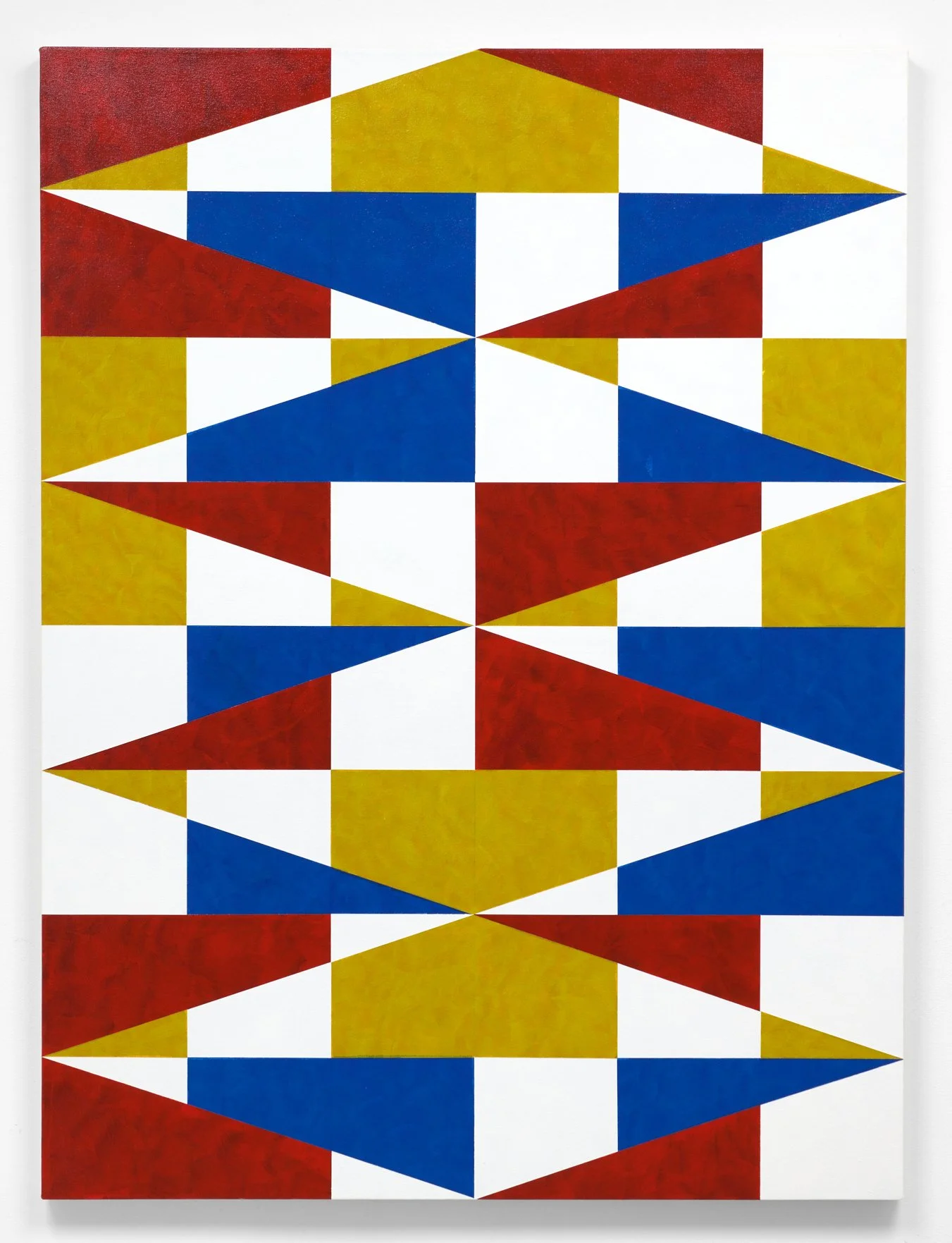 Abstract geometric artwork with triangular shapes in red, blue, white, and yellow, arranged in a symmetrical pattern.