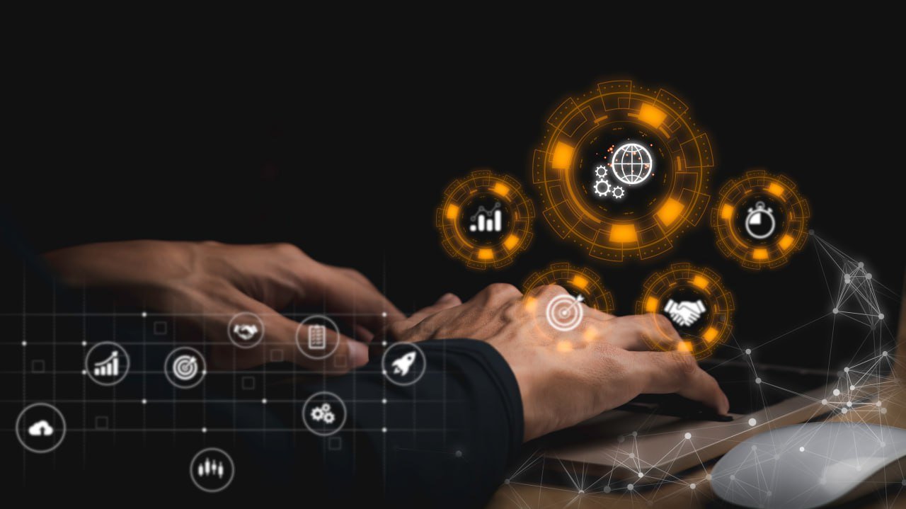 Person typing on a laptop with digital icons and graphics representing technology, data analysis, and innovation floating above.