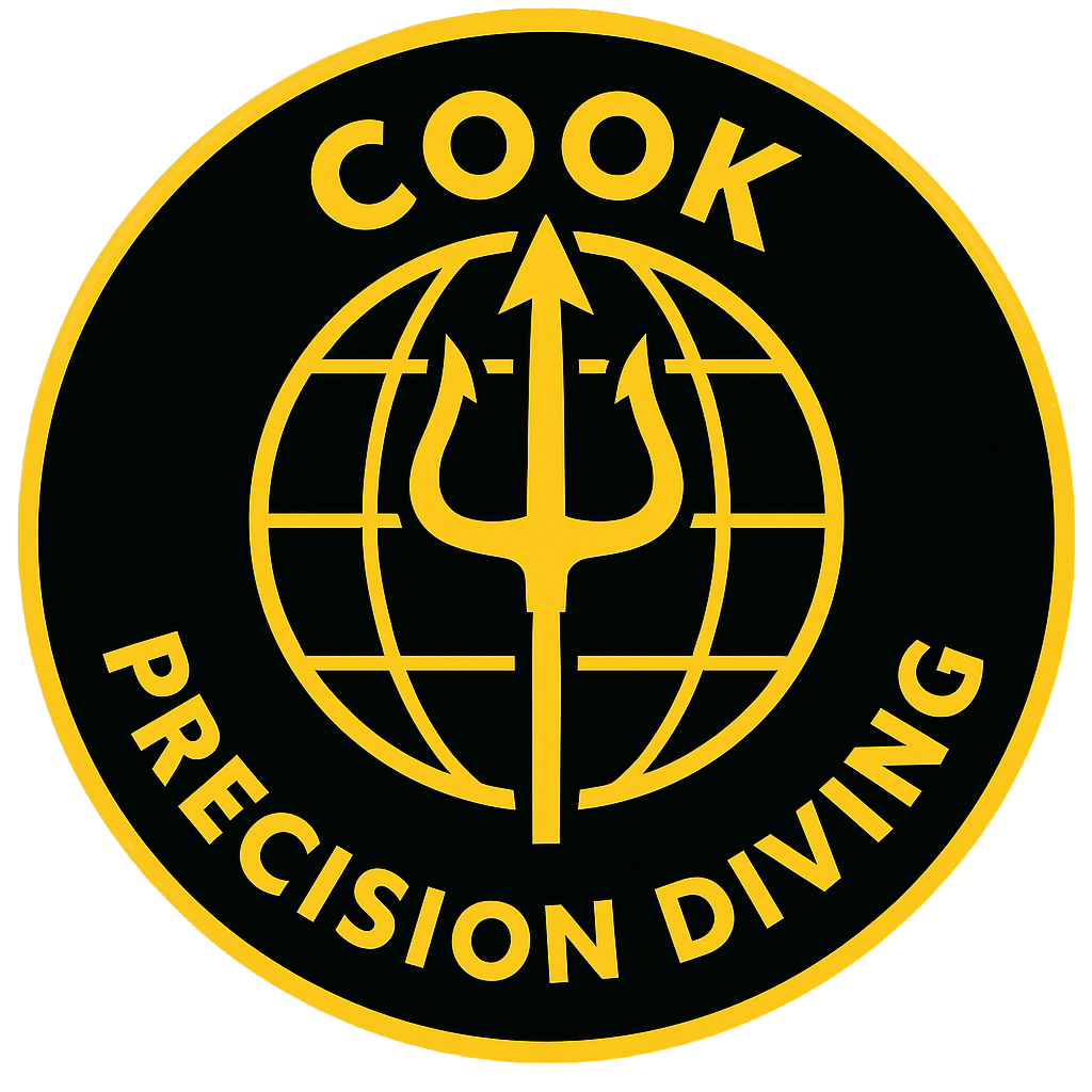 A black circular badge with yellow outlines and text. The badge features a globe with grid lines in the center, and a trident symbol crossing through the globe. The words 'COOK' are at the top and 'PRECISION DIVING' at the bottom of the badge.