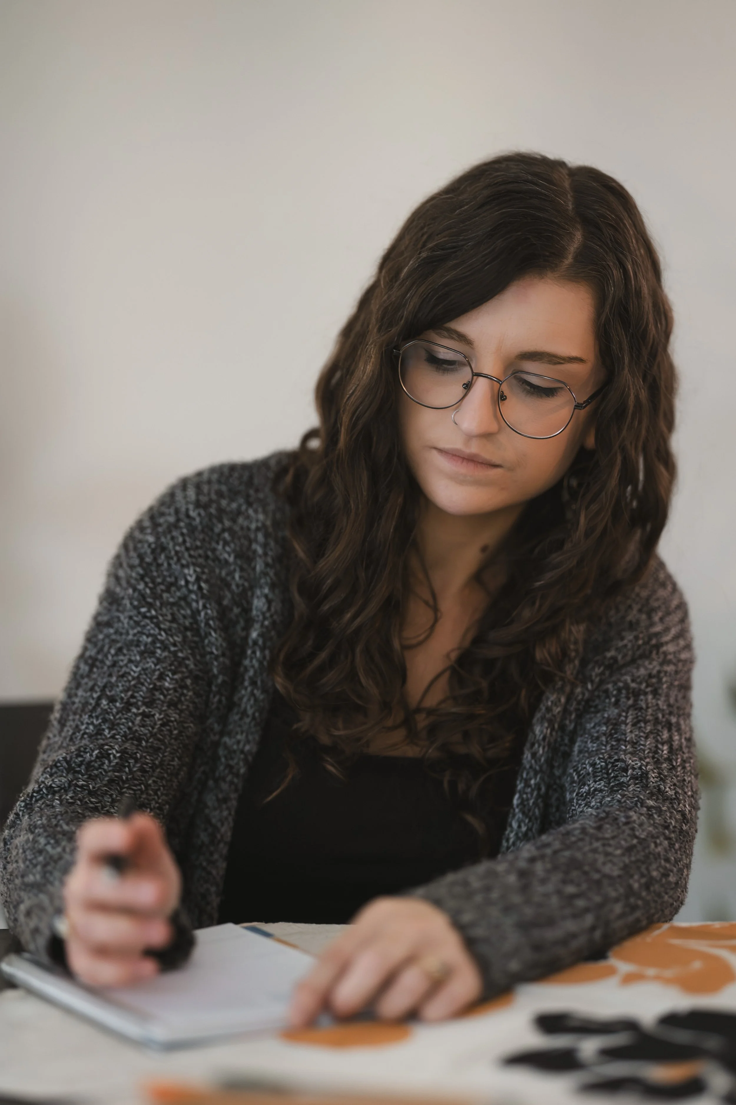 woman writing in planner