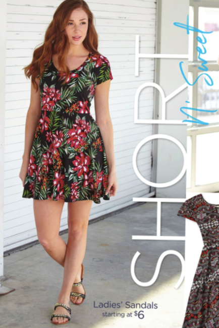 A woman in a floral dress standing indoors near a window, with a second floral dress partially visible next to her.