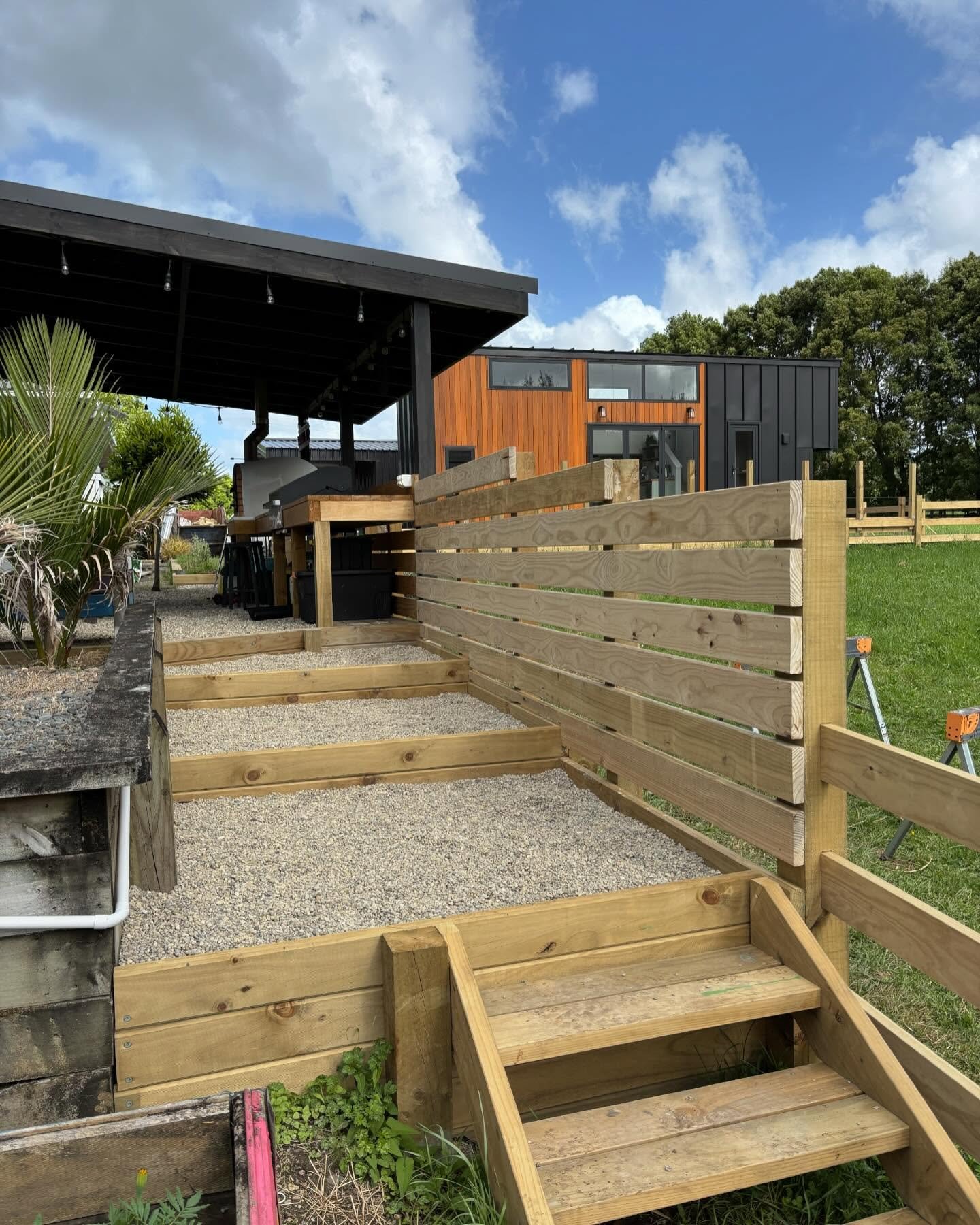 Steps down to the veggie garden, designed for easy access from the outdoor cooking area that I built earlier this year for a client in Coatesville.
The steps and privacy screening lead past the hot tub into the BBQ area, opening into an entertaining 