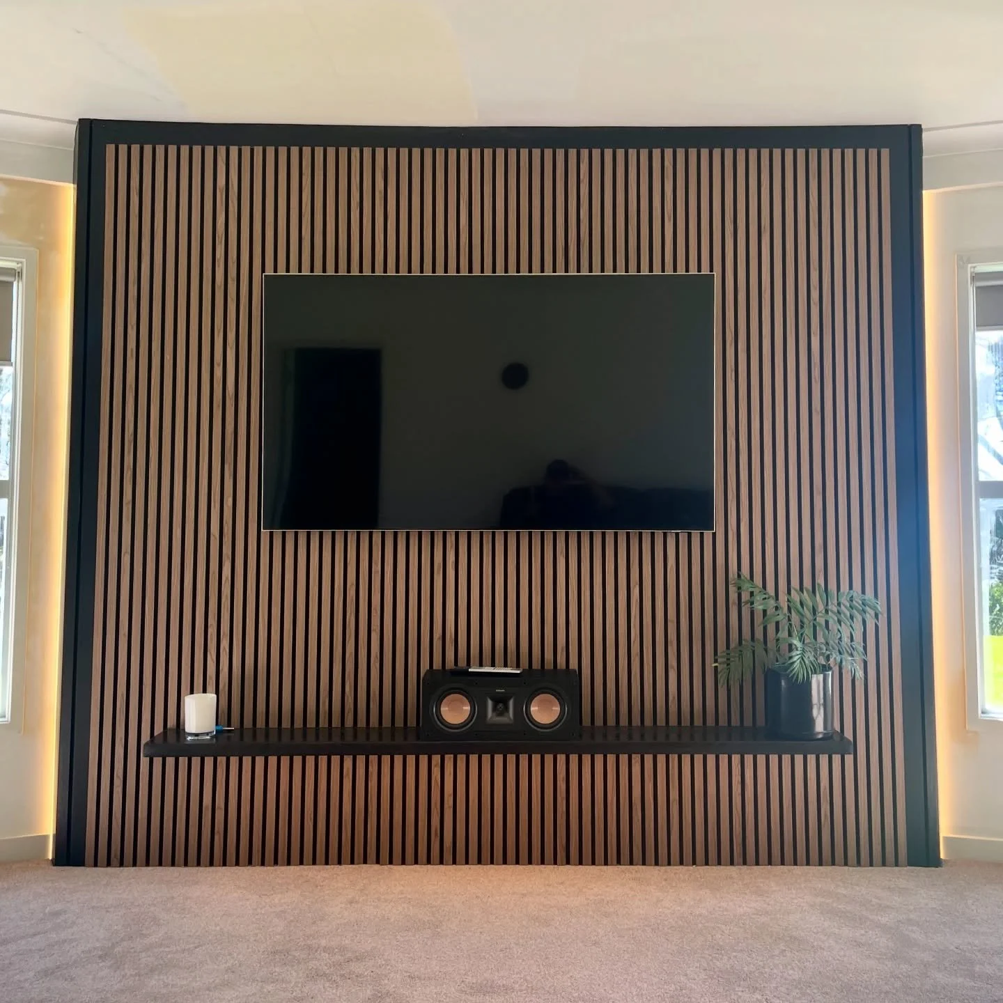 A feature wall we recently completed for a client.
This was a really enjoyable project, designed with a hidden drawer to discreetly house the amplifier and consoles,